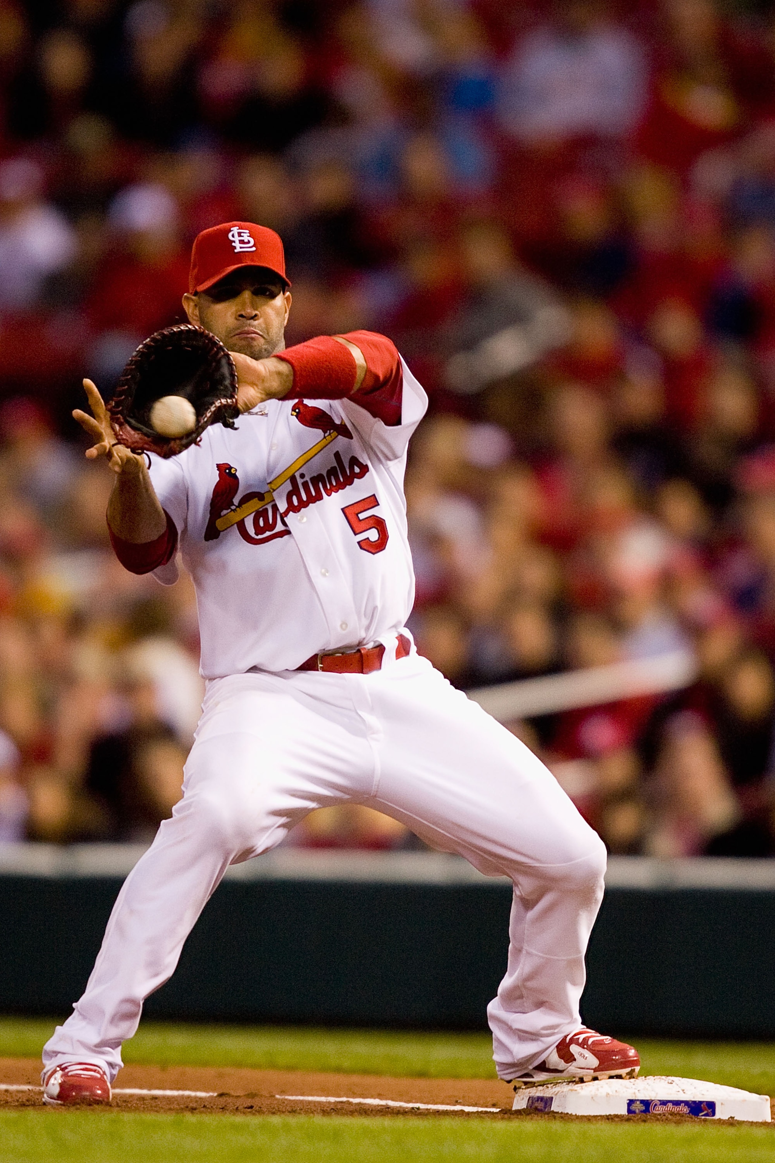 ST. LOUIS - MAY 17:  Albert Pujols #5 of the St. Louis Cardinals fields a throw to first base against the Washington Nationals at Busch Stadium on May 17, 2010 in St. Louis, Missouri.  (Photo by Dilip Vishwanat/Getty Images)