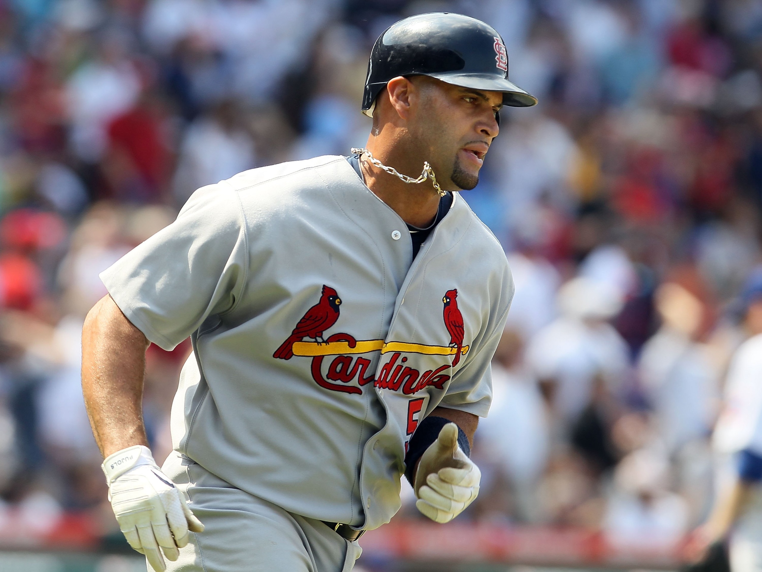 CHICAGO - MAY 30:  Albert Pujols #5 of the St. Louis Cardinals runs against the Chicago Cubs on May 30, 2010 at Wrigley Field in Chicago, Illinois.  (Photo by Jim McIsaac/Getty Images)