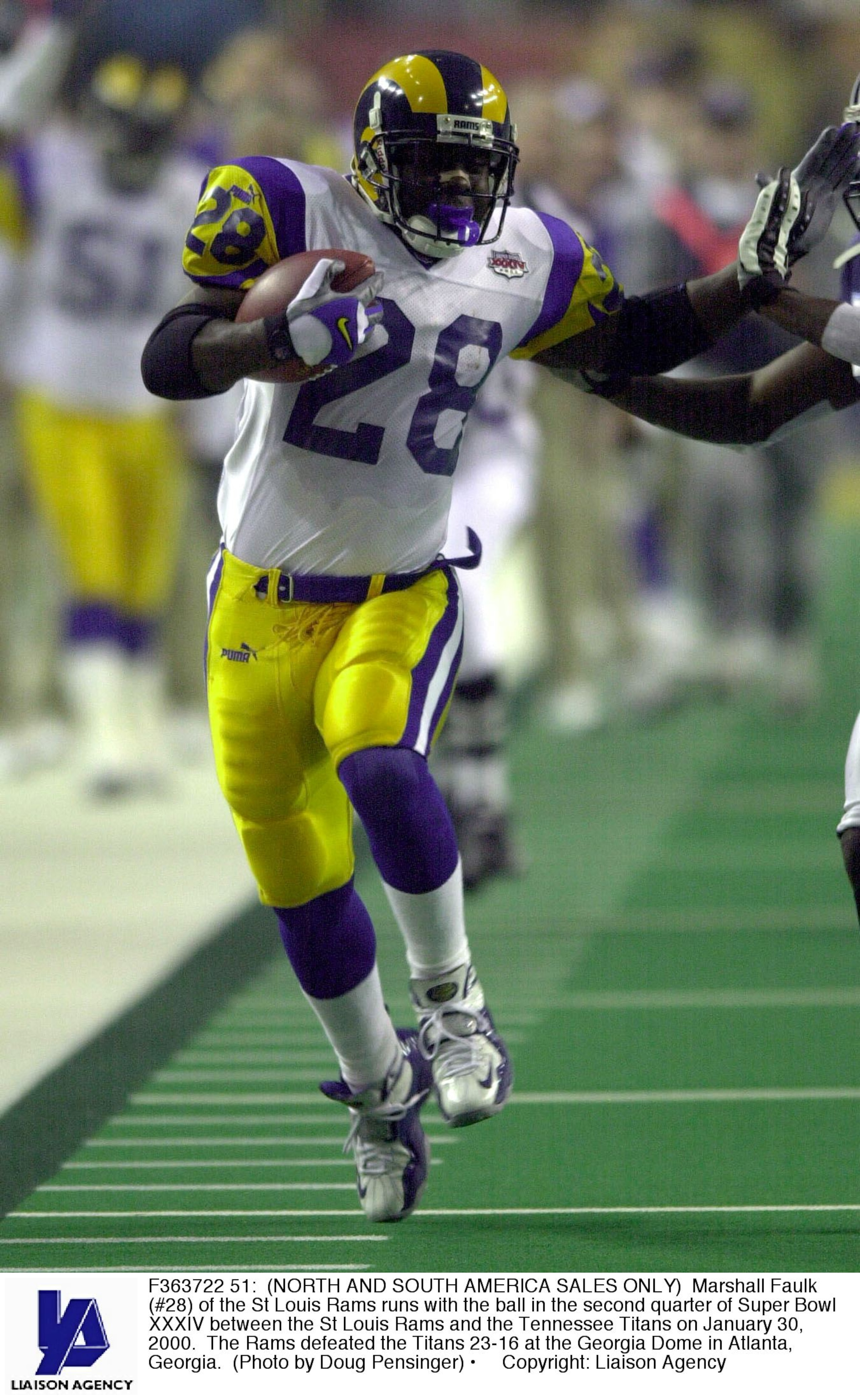 F363722 51: (NORTH AND SOUTH AMERICA SALES ONLY) Marshall Faulk (#28) of the St Louis Rams runs with the ball in the second quarter of Super Bowl XXXIV between the St Louis Rams and the Tennessee Titans on January 30, 2000. The Rams defeated the Titans 23 F363722 51: (NORTH AND SOUTH AMERICA SALES ONLY) Marshall Faulk (#28) of the St Louis Rams runs with the ball in the second quarter of Super Bowl XXXIV between the St Louis Rams and the Tennessee Titans on January 30, 2000. The Rams defeated the Titans 23