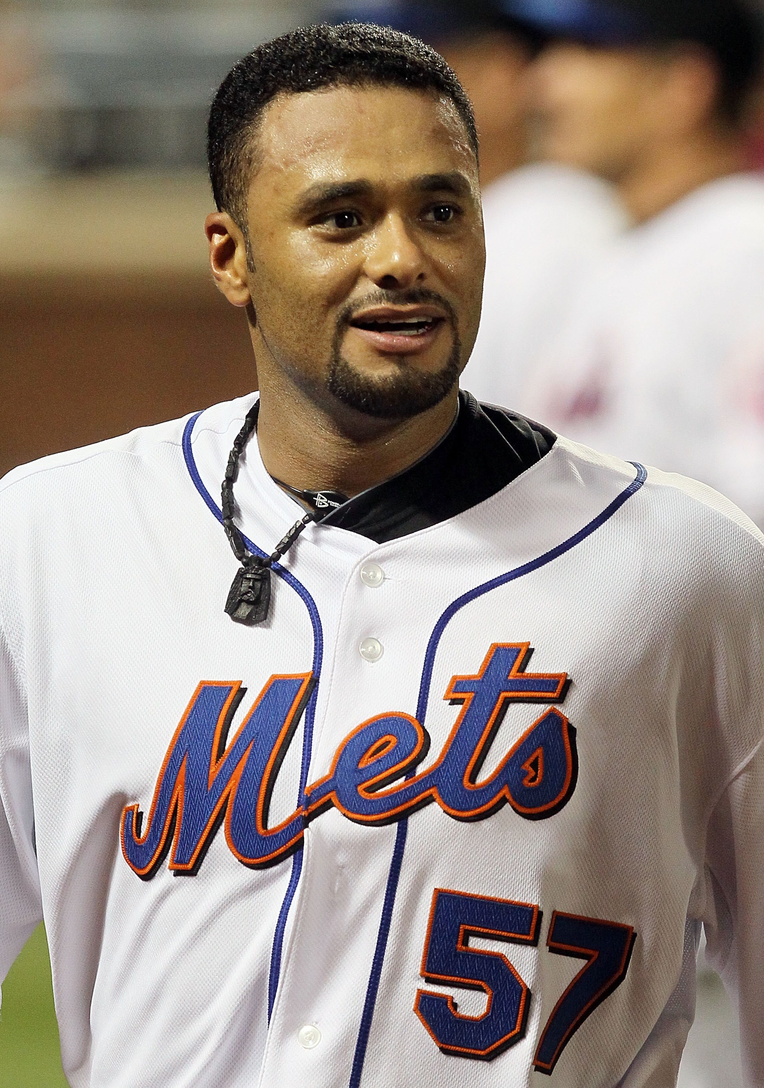 NEW YORK - JULY 06:  Johan Santana #57 of the New York Mets looks on against the Cincinnati Reds on July 6, 2010 at Citi Field in the Flushing neighborhood of the Queens borough of New York City.  (Photo by Jim McIsaac/Getty Images)