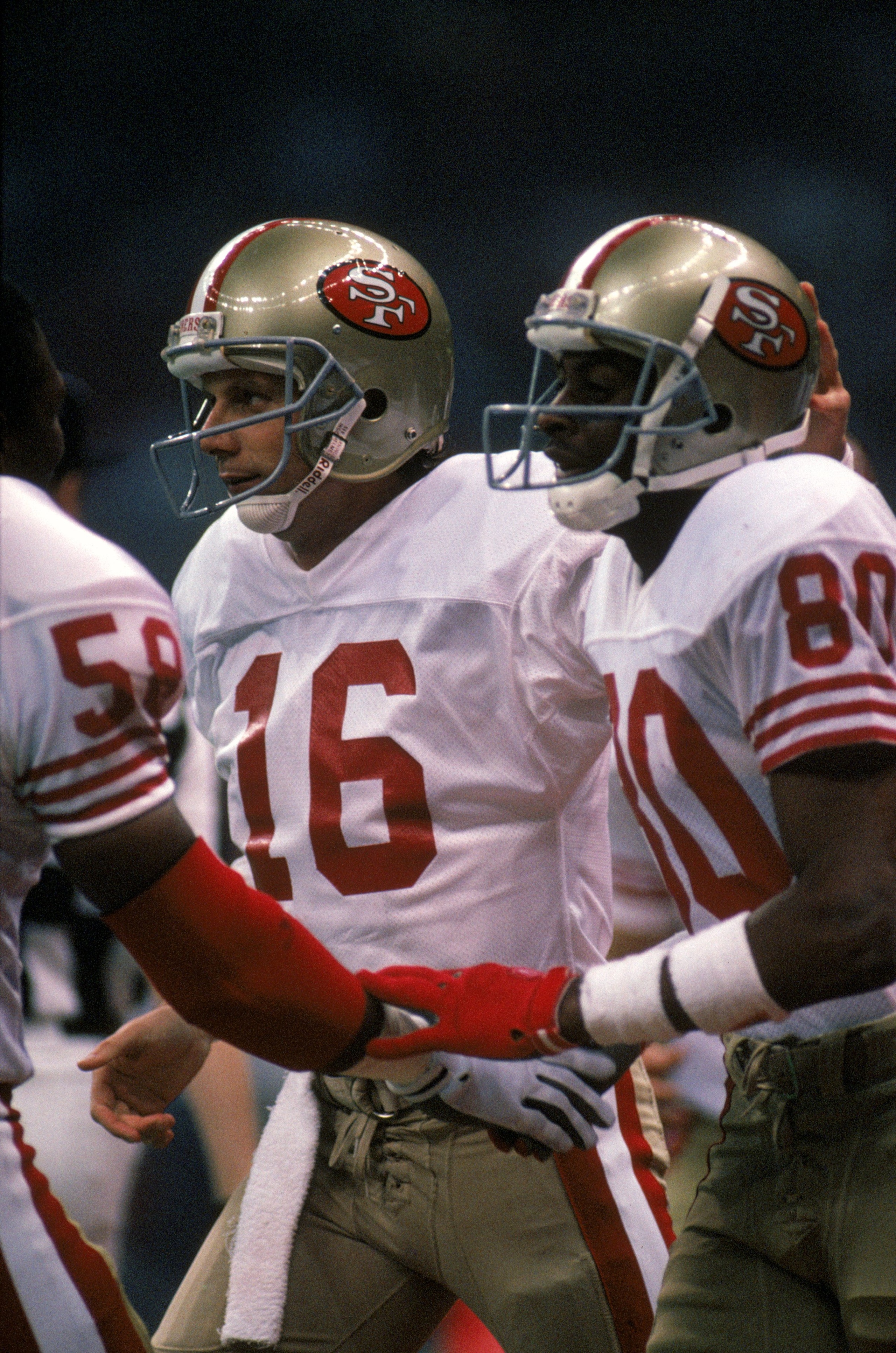 NEW ORLEANS - JANUARY 28: Quarterback Joe Montana #16 and wide receiver Jerry Rice #80 of the San Francisco 49ers celebrate in Super Bowl XXIV against the Denver Broncos at Louisiana Superdome on January 28, 1990 in New Orleans, Louisiana. The 49ers won NEW ORLEANS - JANUARY 28: Quarterback Joe Montana #16 and wide receiver Jerry Rice #80 of the San Francisco 49ers celebrate in Super Bowl XXIV against the Denver Broncos at Louisiana Superdome on January 28, 1990 in New Orleans, Louisiana. The 49ers won