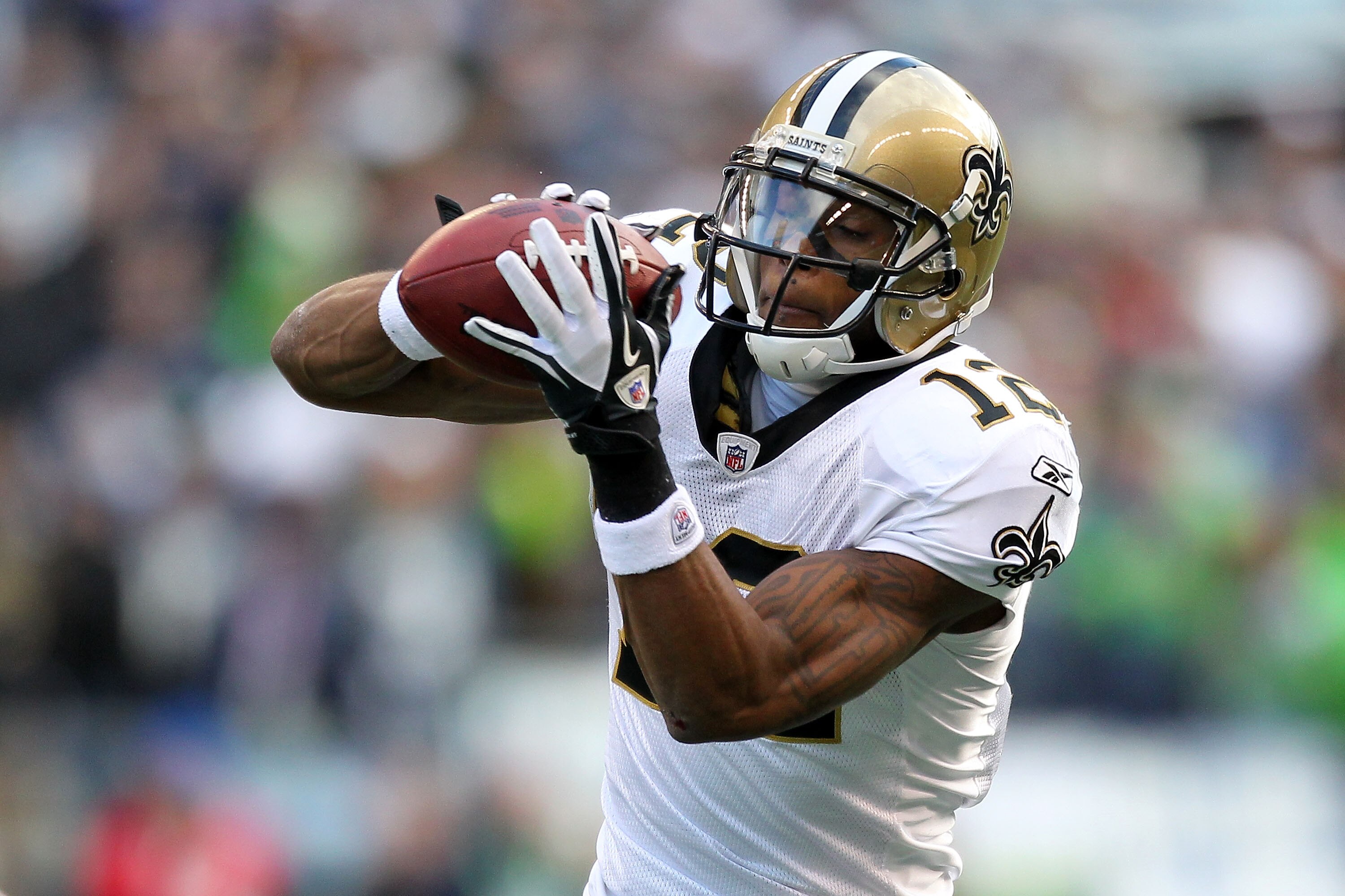 SEATTLE, WA - JANUARY 08:  Marques Colston #12 of the New Orleans Saints catches a pass against the Seattle Seahawks during the 2011 NFC wild-card playoff game at Qwest Field on January 8, 2011 in Seattle, Washington.  (Photo by Otto Greule Jr/Getty Image