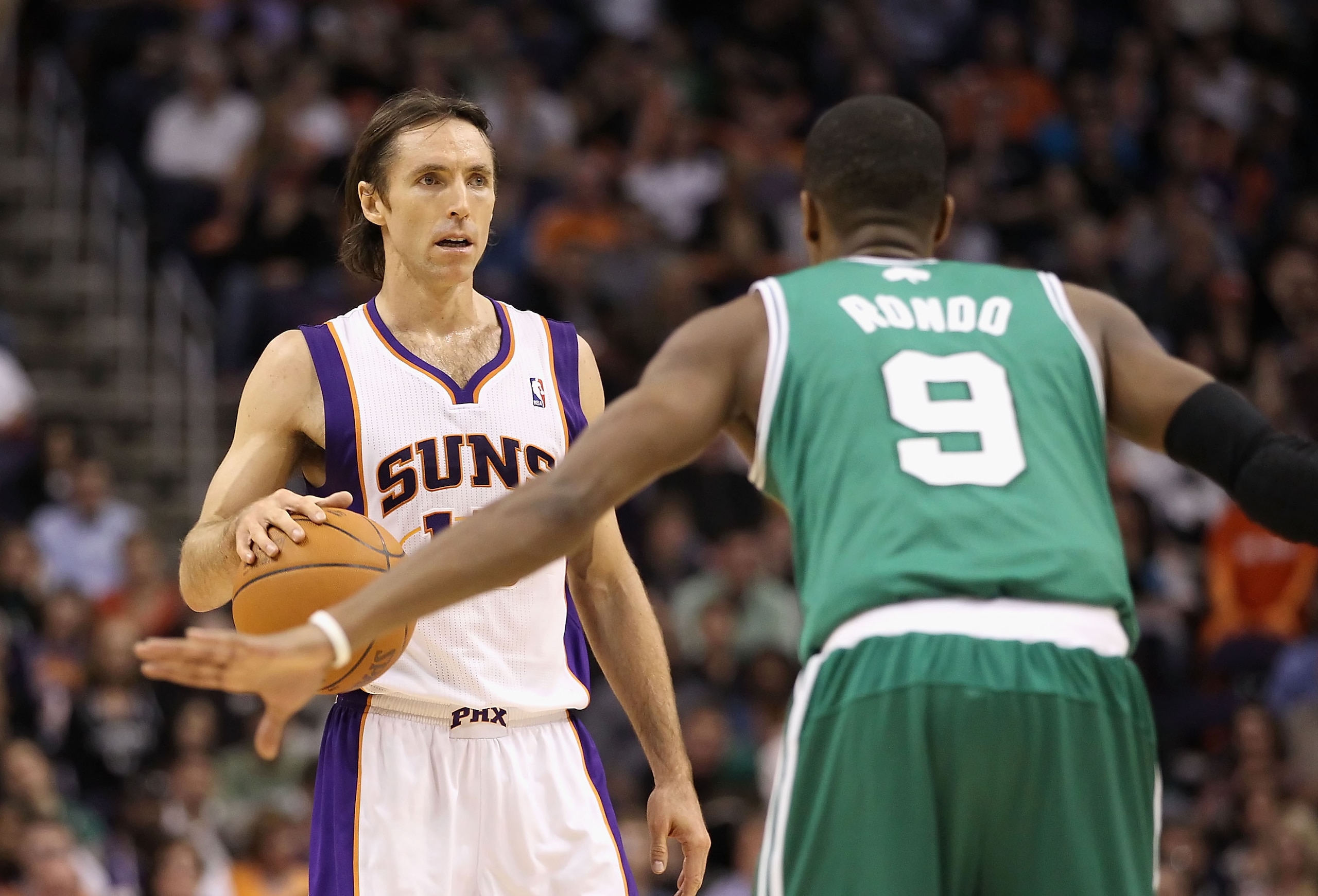 PHOENIX, AZ - JANUARY 28:  Steve Nash #13 of the Phoenix Suns handles the ball during the NBA game against the Boston Celtics at US Airways Center on January 28, 2011 in Phoenix, Arizona.  The Suns defeated the Celtics 88-71.  NOTE TO USER: User expressly
