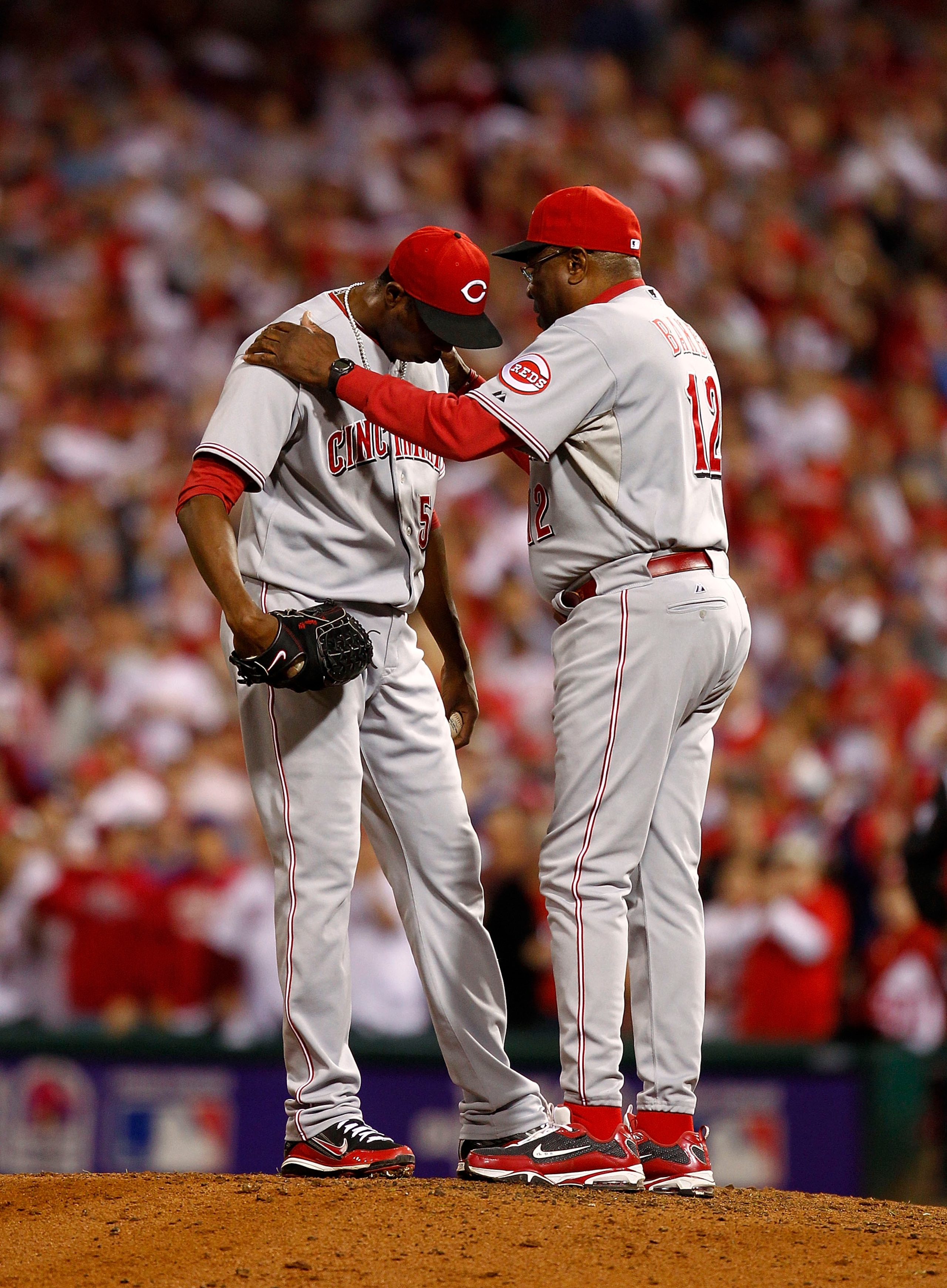 PHILADELPHIA - OCTOBER 08: Dusty Baker #12 talks with Aroldis Chapman #54 of the Cincinnati Reds in Game 2 of the NLDS against the Philadelphia Phillies at Citizens Bank Park on October 8, 2010 in Philadelphia, Pennsylvania. (Photo by Jeff Zelevansky/Ge PHILADELPHIA - OCTOBER 08: Dusty Baker #12 talks with Aroldis Chapman #54 of the Cincinnati Reds in Game 2 of the NLDS against the Philadelphia Phillies at Citizens Bank Park on October 8, 2010 in Philadelphia, Pennsylvania. (Photo by Jeff Zelevansky/Ge
