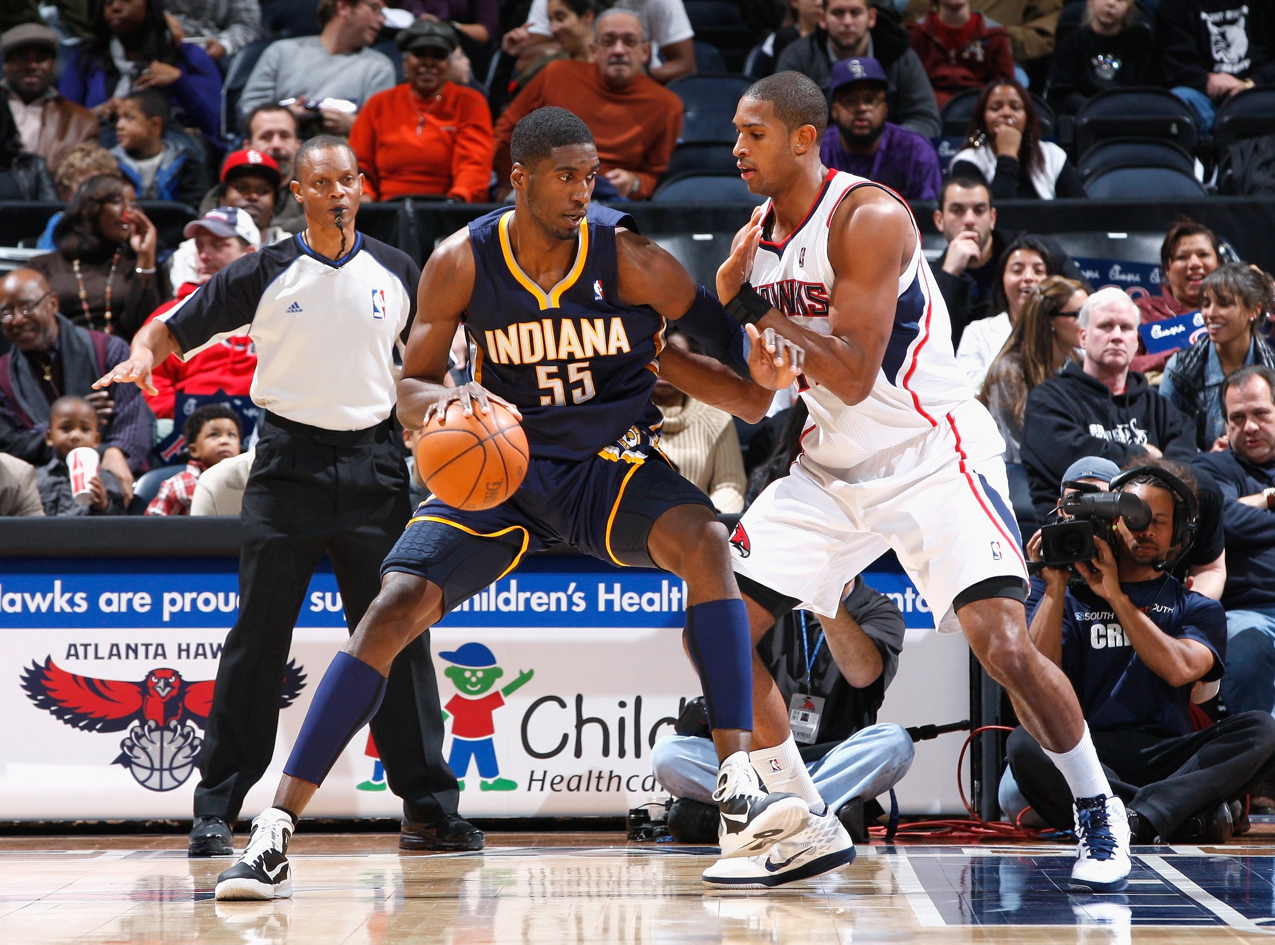ATLANTA, GA - DECEMBER 11:  Roy Hibbert #55 of the Indiana Pacers against Al Horford #15 of the Atlanta Hawks at Philips Arena on December 11, 2010 in Atlanta, Georgia.  NOTE TO USER: User expressly acknowledges and agrees that, by downloading and/or usin