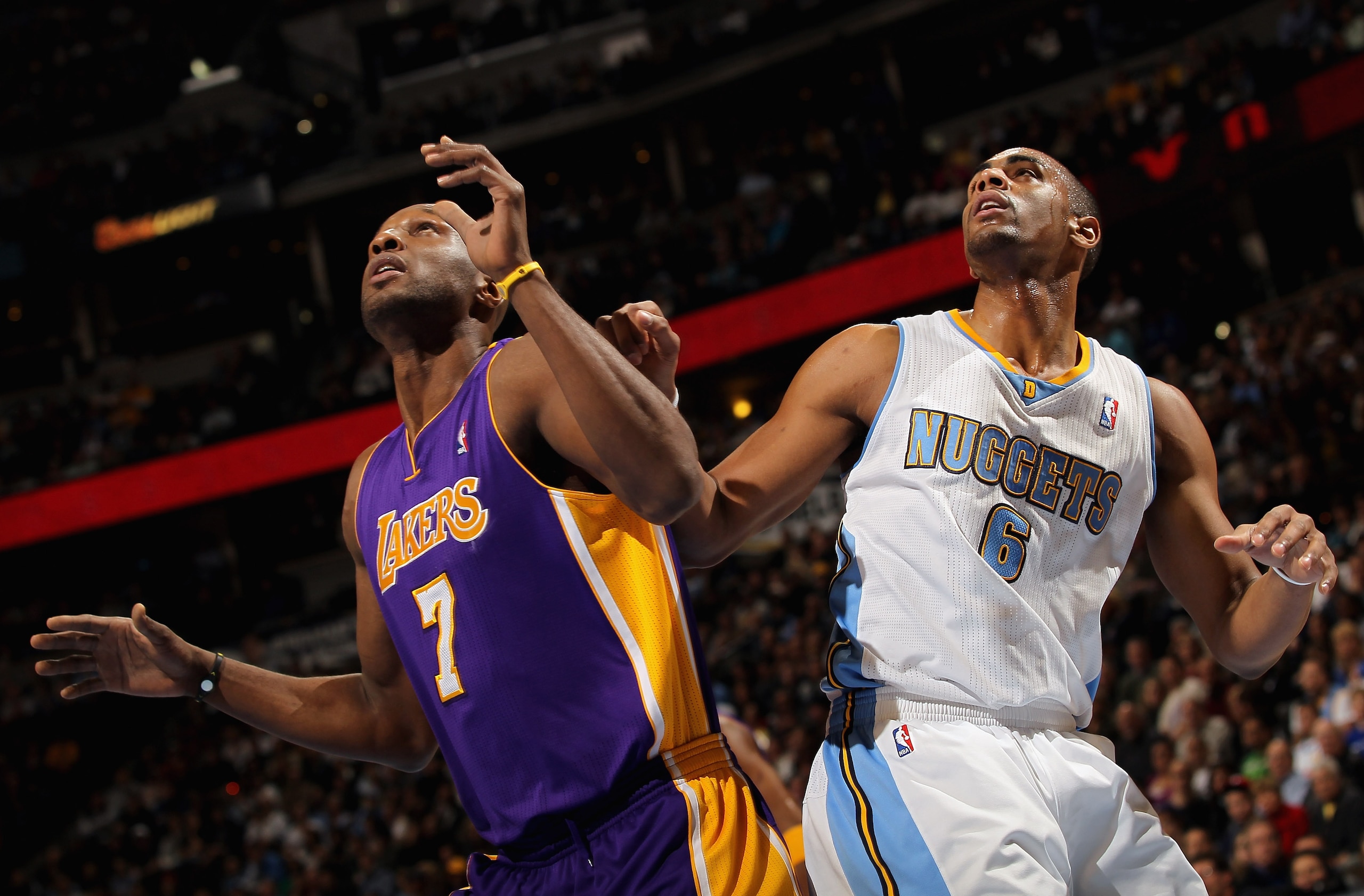 DENVER, CO - JANUARY 21:  Lamar Odom #7 of the Los Angeles Lakers and Arron Afflalo #6 of the Denver Nuggets battle for rebounding position at the Pepsi Center on January 21, 2011 in Denver, Colorado. NOTE TO USER: User expressly acknowledges and agrees t