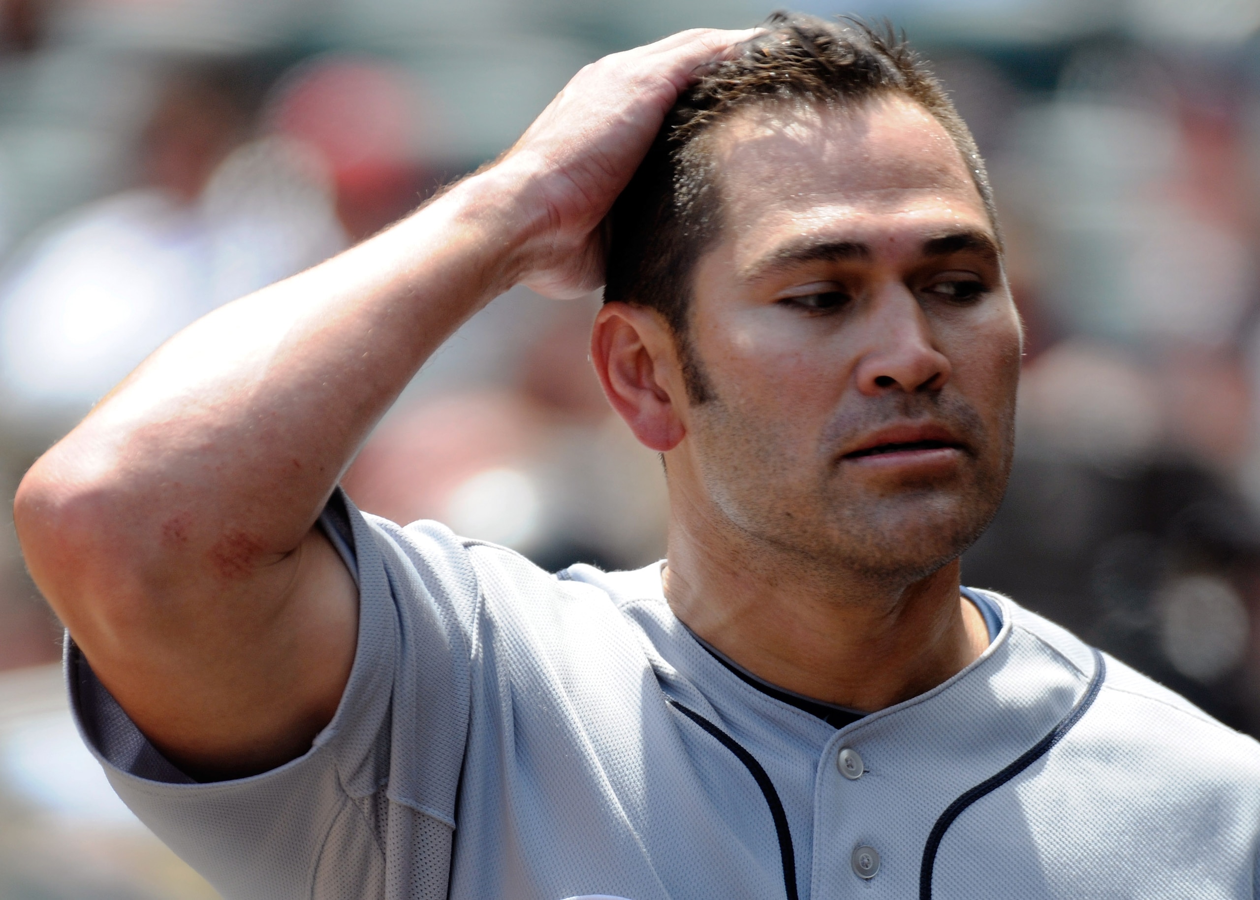 MINNEAPOLIS, MN - JUNE 30: Johnny Damon #18 of the Detroit Tigers reacts in the dugout after lining out in the sixth inning against the Minnesota Twins during their game on June 30, 2010 at Target Field in Minneapolis, Minnesota. (Photo by Hannah Foslien