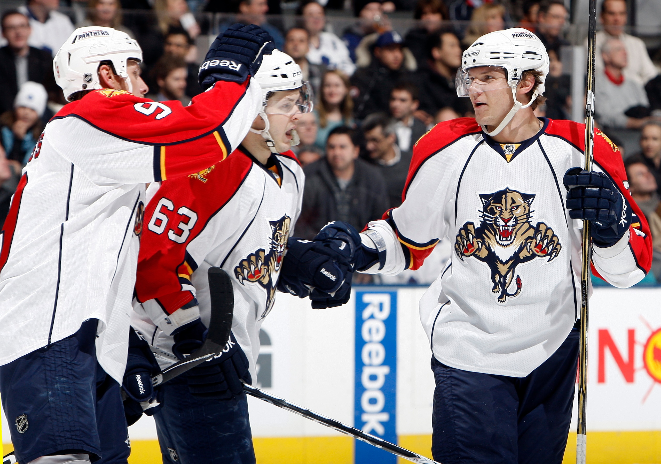 TORONTO, CANADA - FEBRUARY 1:  Stephen Weiss #9, Evgeni Dadonov #63 and  Dmitry Kulikov #7 of the Florida Panthers celebrate goal against the Toronto Maple Leafs during game action at the Air Canada Centre February 1, 2011 in Toronto, Ontario, Canada. (Ph