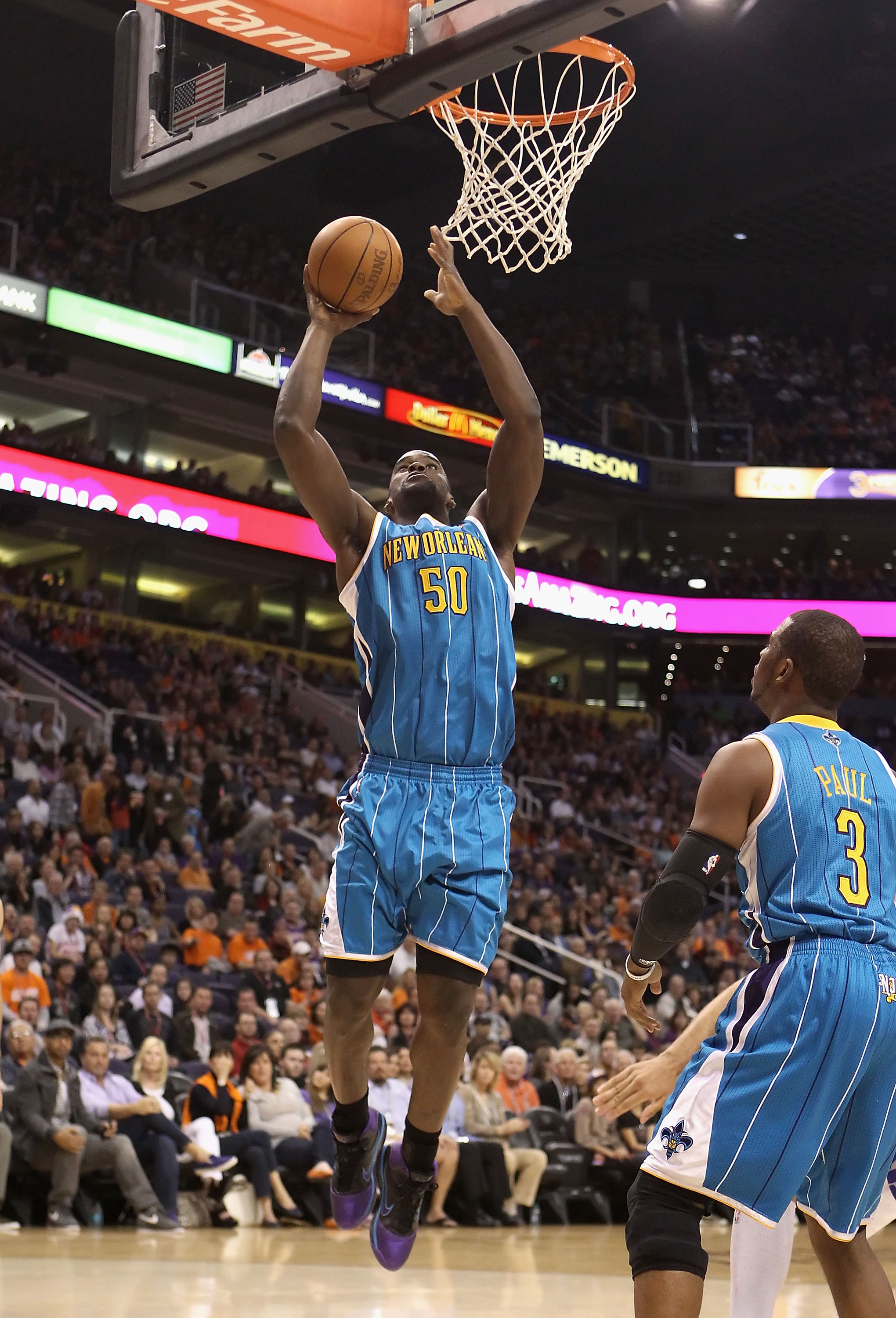 PHOENIX, AZ - JANUARY 30:  Emeka Okafor #50 of the New Orleans Hornets puts up a shot against the Phoenix Suns during the NBA game at US Airways Center on January 30, 2011 in Phoenix, Arizona.  NOTE TO USER: User expressly acknowledges and agrees that, by