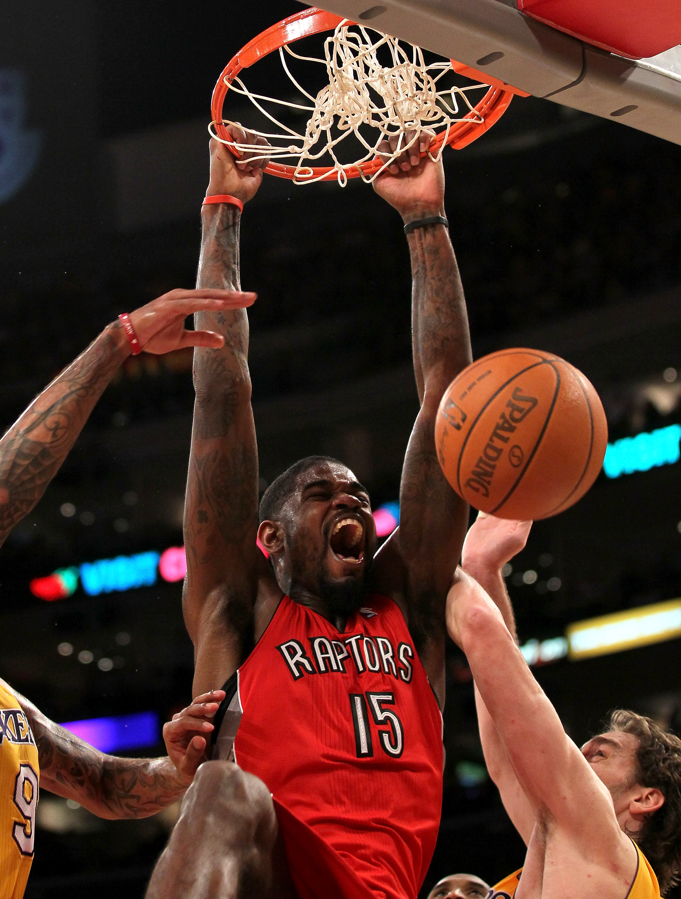 LOS ANGELES, CA - NOVEMBER 05:  Amir Johnson #15 of  the Toronto Raptors dunks against the Los Angeles Lakers at Staples Center on November 5, 2010 in Los Angeles, California.  The Lakers won 108-102.   NOTE TO USER: User expressly acknowledges and agrees