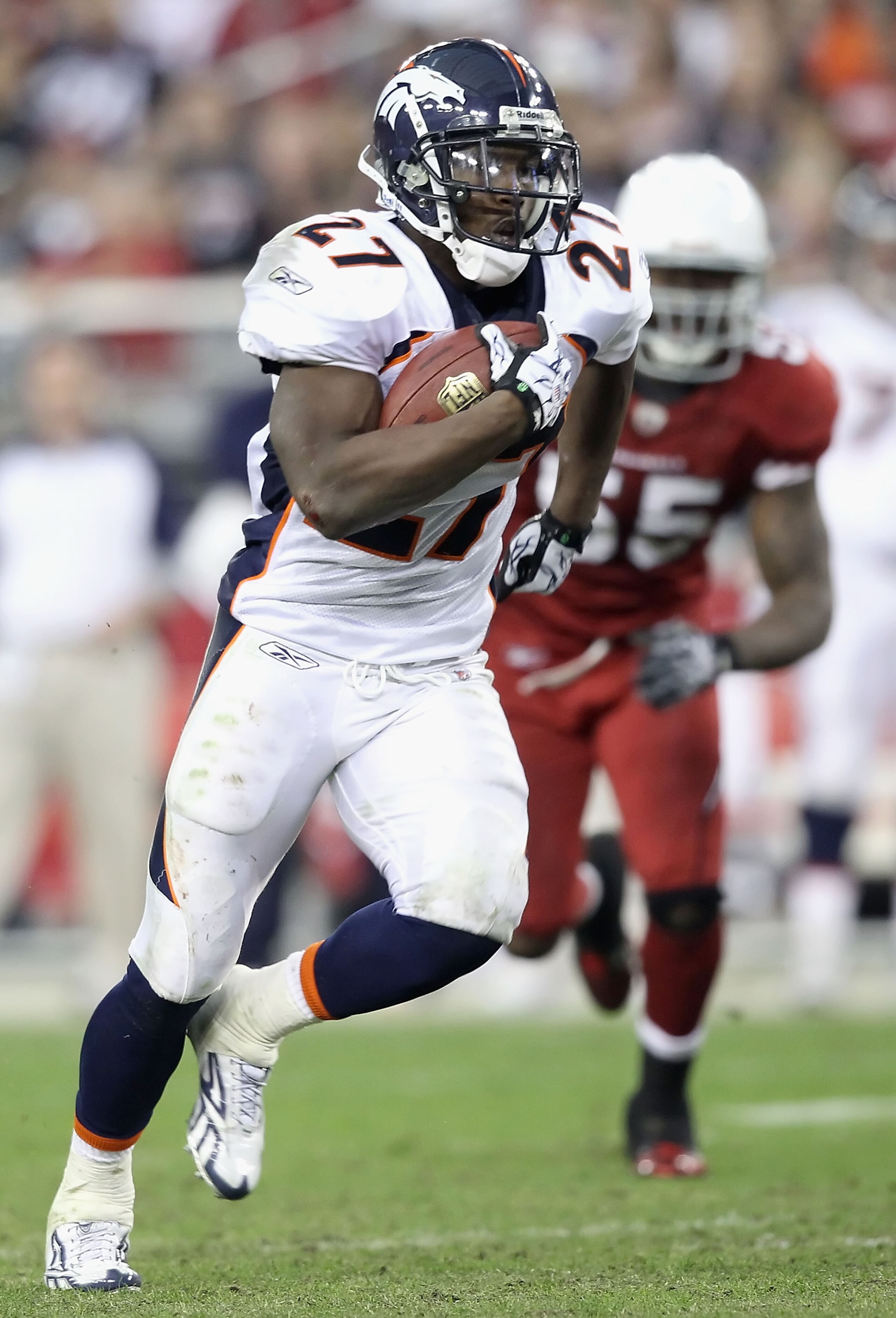 GLENDALE, AZ - DECEMBER 12:  Runningback Knowshon Moreno #27 of the Denver Broncos rushes the football past Joey Porter #55 of the Arizona Cardinals during the NFL game at the University of Phoenix Stadium on December 12, 2010 in Glendale, Arizona. The Ca