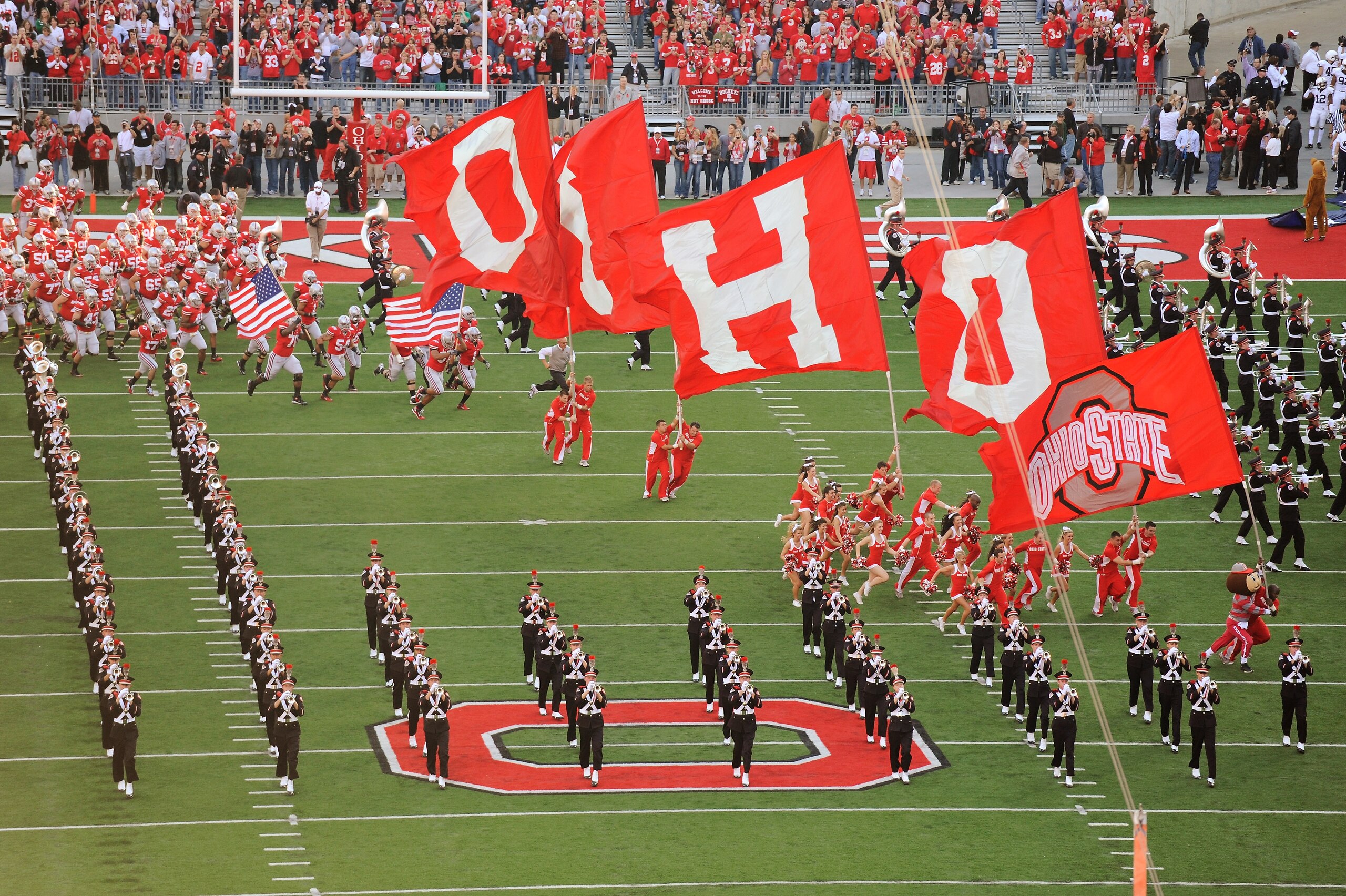 COLUMBUS, OH - NOVEMBER 13: Bryant Browning #70 of the Ohio State Buckeyes and Cameron Heyward #97 of the Ohio State Buckeyes carry American flags to lead the Buckeyes on to the field before a game against the Penn State Nittany Lions at Ohio Stadium on COLUMBUS, OH - NOVEMBER 13: Bryant Browning #70 of the Ohio State Buckeyes and Cameron Heyward #97 of the Ohio State Buckeyes carry American flags to lead the Buckeyes on to the field before a game against the Penn State Nittany Lions at Ohio Stadium on