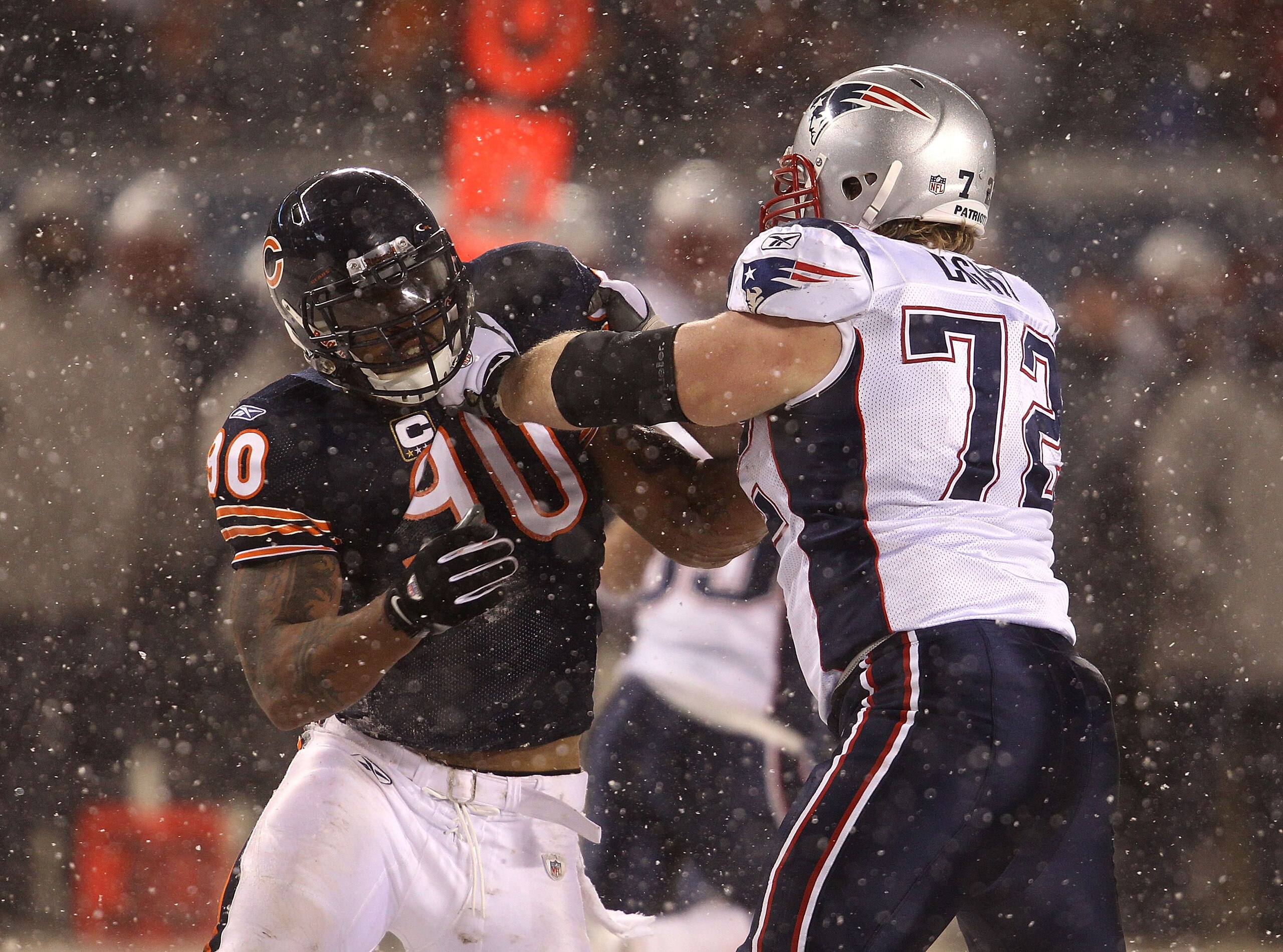 CHICAGO, IL - DECEMBER 12: Julius Peppers #90 of the Chicago Bears rushes against Matt Light #72 of the New England Patriots at Soldier Field on December 12, 2010 in Chicago, Illinois. The Patriots defeated the Bears 36-7. (Photo by Jonathan Daniel/Getty