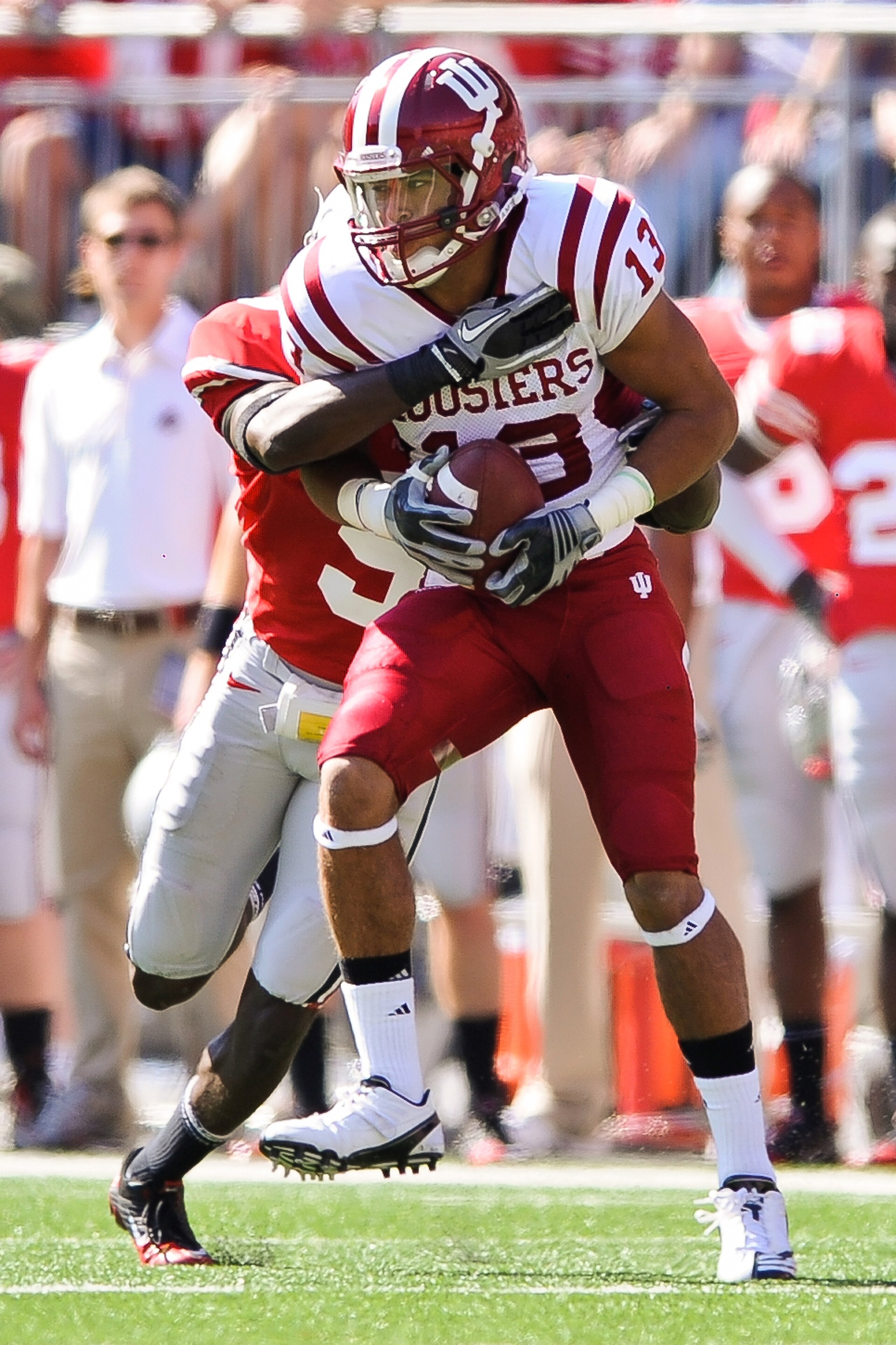 COLUMBUS, OH - OCTOBER 9: Kofi Hughes #13 of the Indiana Hoosiers runs with the ball after making a catch against the Ohio State Buckeyes at Ohio Stadium on October 9, 2010 in Columbus, Ohio. (Photo by Jamie Sabau/Getty Images) COLUMBUS, OH - OCTOBER 9: Kofi Hughes #13 of the Indiana Hoosiers runs with the ball after making a catch against the Ohio State Buckeyes at Ohio Stadium on October 9, 2010 in Columbus, Ohio. (Photo by Jamie Sabau/Getty Images)