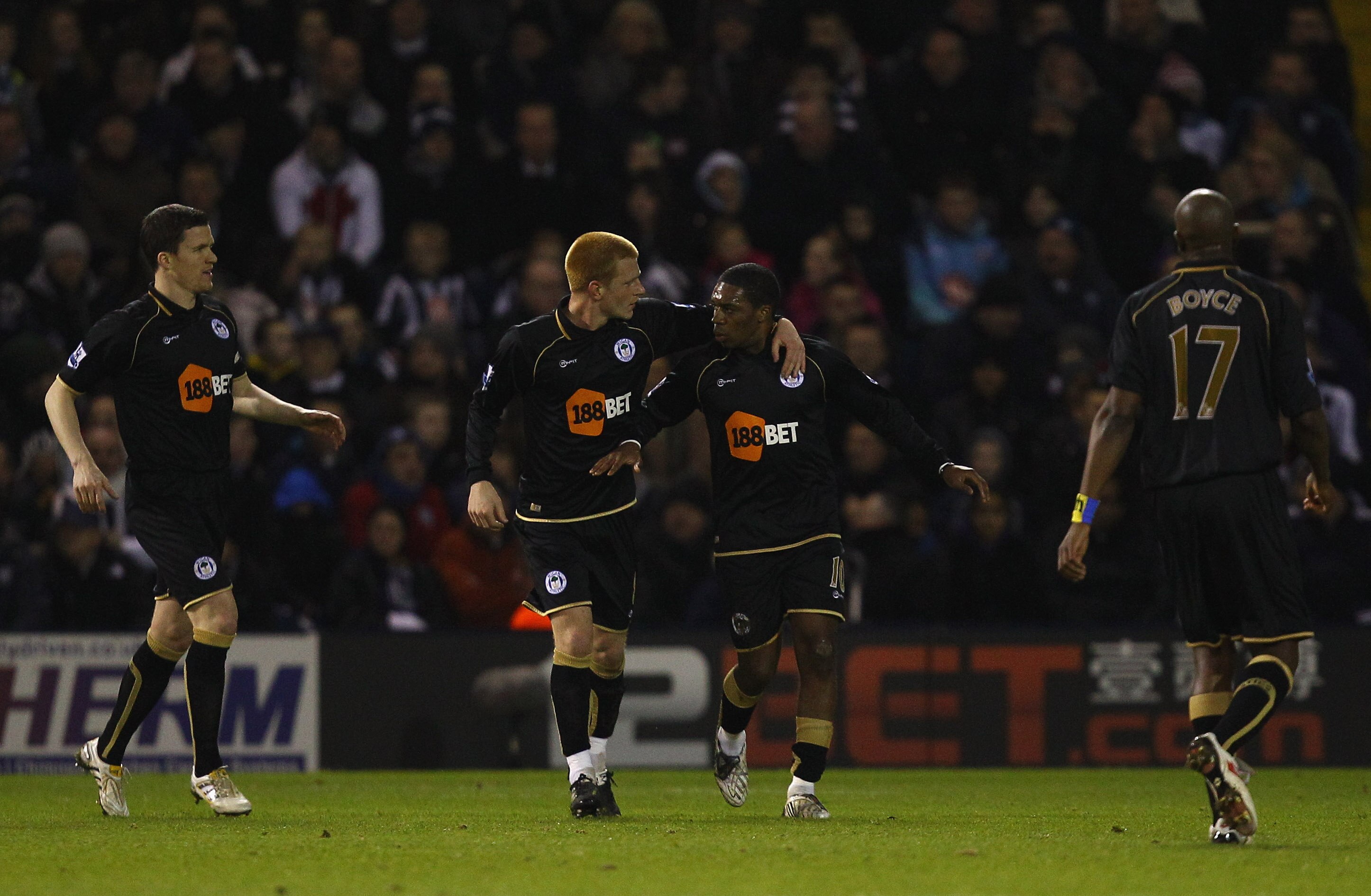 WEST BROMWICH, ENGLAND - FEBRUARY 01:  Ben Watson of Wigan congratulates Charles N'Zogbia on scoring thier first goal during the Barclays Premier League match between West Bromwich Albion and Wigan Athletic at The Hawthorns on February 1, 2011 in West Bro