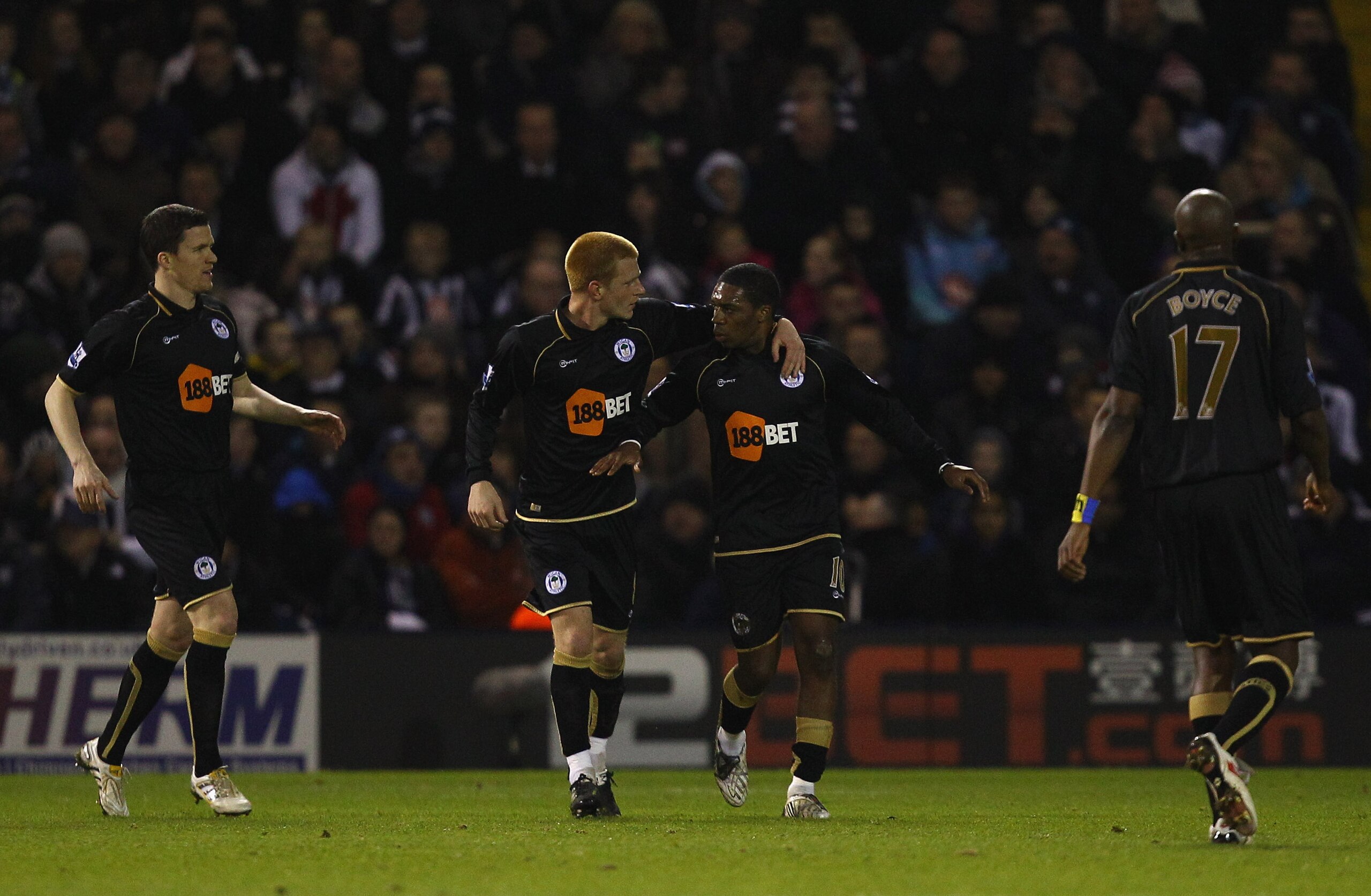 WEST BROMWICH, ENGLAND - FEBRUARY 01:  Ben Watson of Wigan congratulates Charles N'Zogbia on scoring thier first goal during the Barclays Premier League match between West Bromwich Albion and Wigan Athletic at The Hawthorns on February 1, 2011 in West Bro