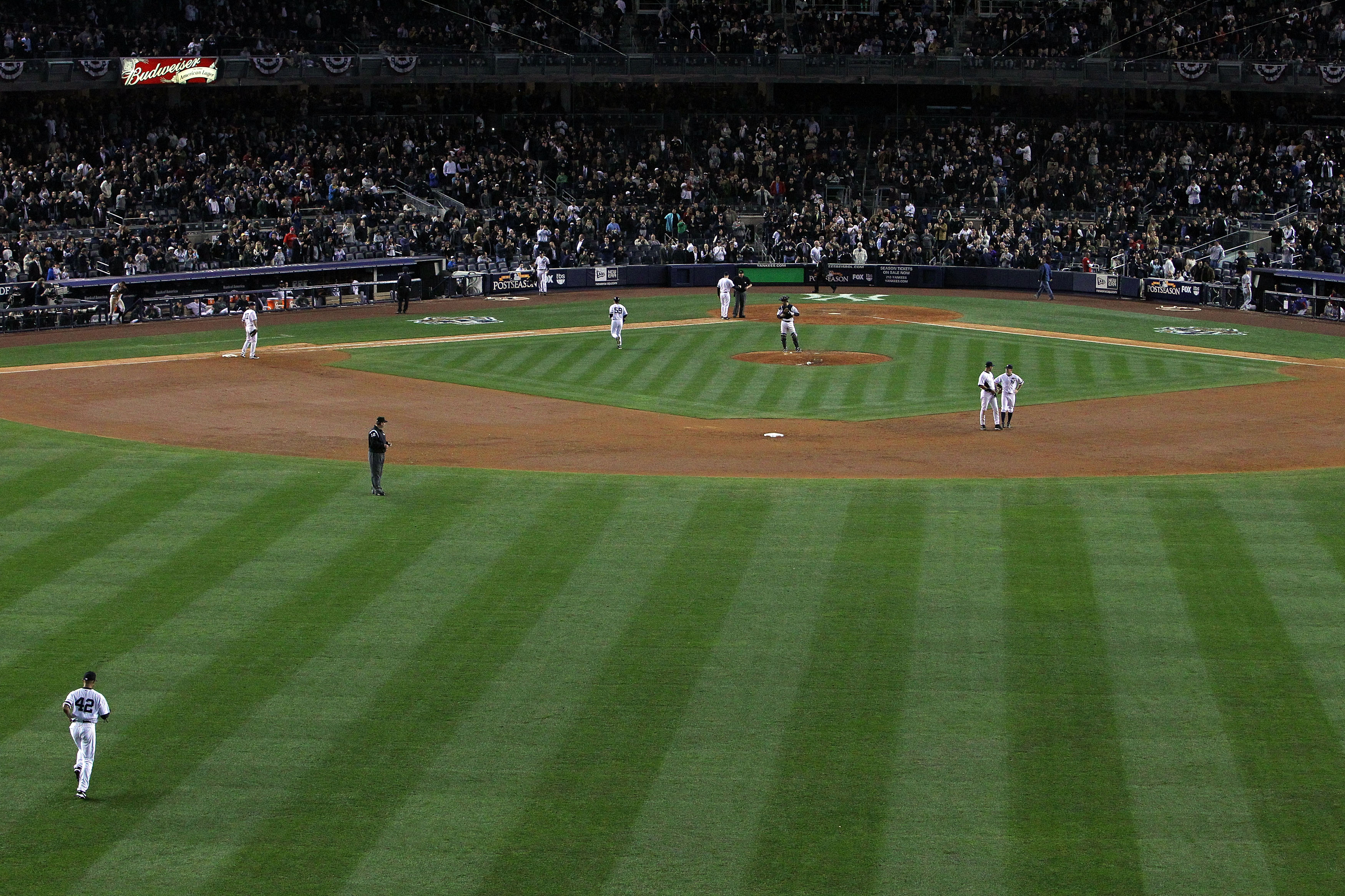 NEW YORK - OCTOBER 20:  Mariano Rivera #42 (lower L) of the New York Yankees runs out of the bullpen onto the field to pitch against the Texas Rangers in Game Five of the ALCS during the 2010 MLB Playoffs at Yankee Stadium on October 20, 2010 in the Bronx