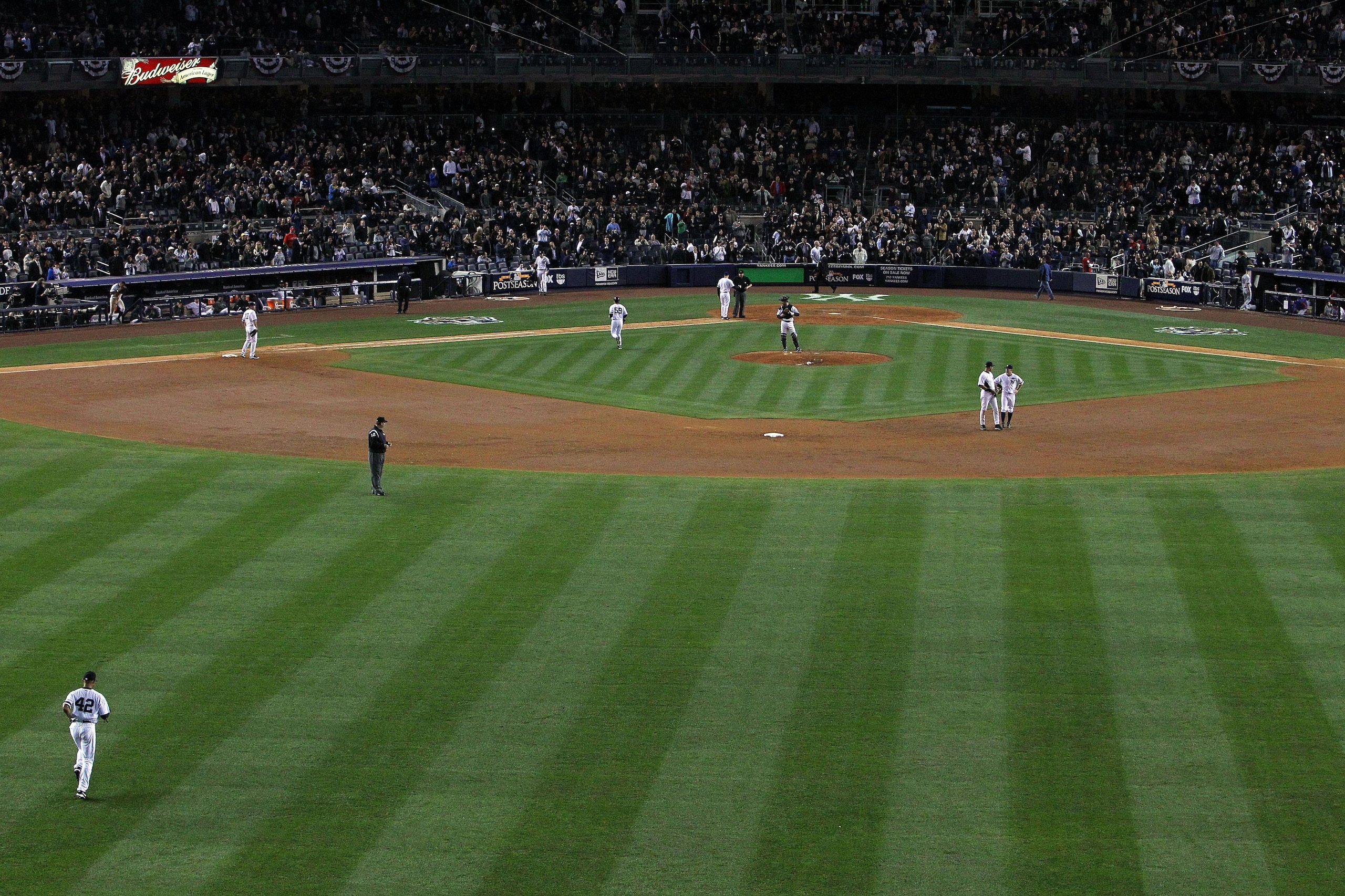 NEW YORK - OCTOBER 20:  Mariano Rivera #42 (lower L) of the New York Yankees runs out of the bullpen onto the field to pitch against the Texas Rangers in Game Five of the ALCS during the 2010 MLB Playoffs at Yankee Stadium on October 20, 2010 in the Bronx
