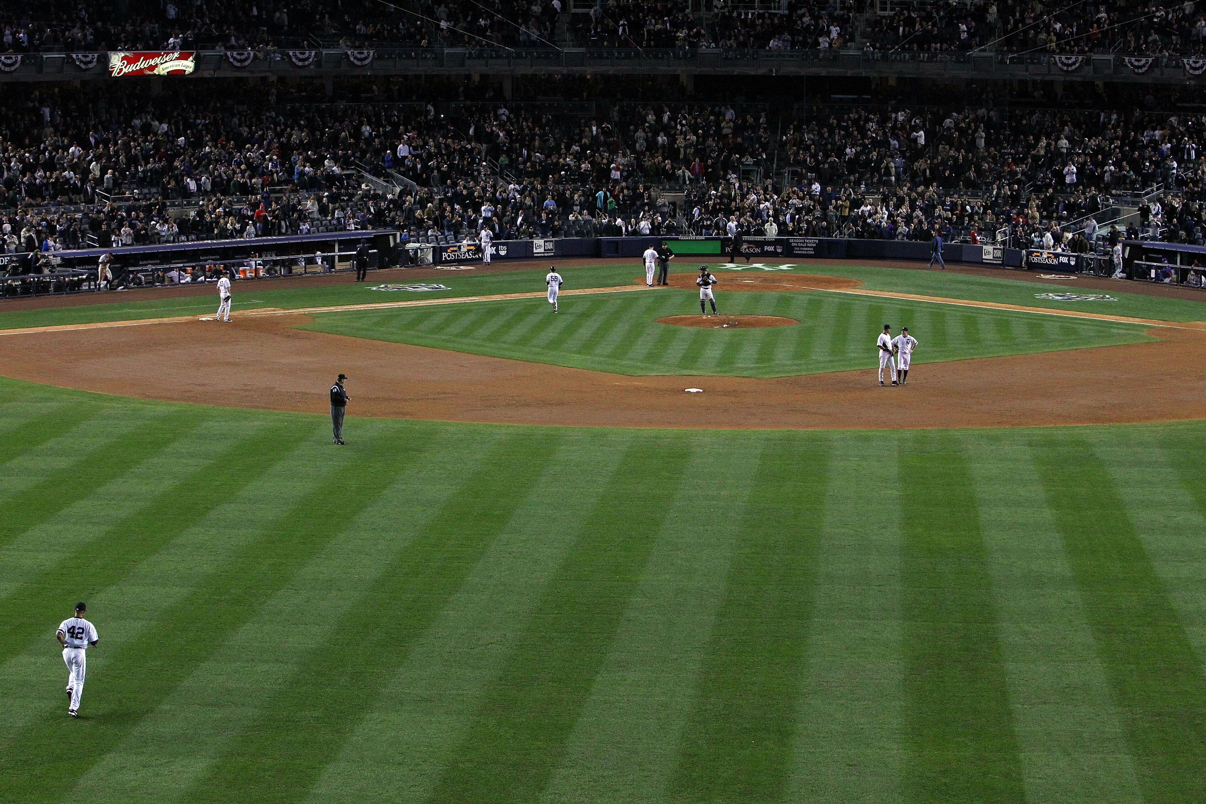 NEW YORK - OCTOBER 20:  Mariano Rivera #42 (lower L) of the New York Yankees runs out of the bullpen onto the field to pitch against the Texas Rangers in Game Five of the ALCS during the 2010 MLB Playoffs at Yankee Stadium on October 20, 2010 in the Bronx