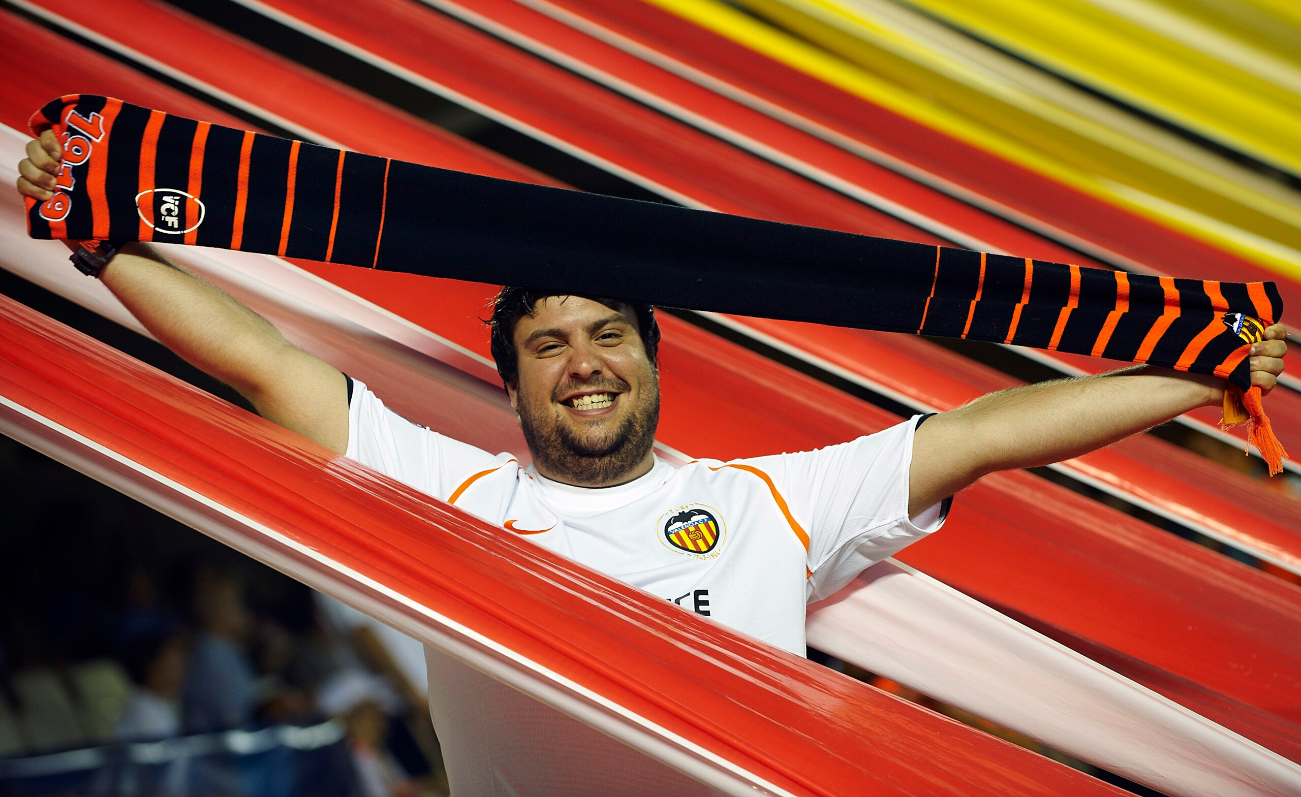 VALENCIA, SPAIN - SEPTEMBER 29: A Valencia fan celebrates during the UEFA Champions League group C match between Valencia and Manchester United on September 29, 2010 in Valencia, Spain.  (Photo by Manuel Queimadelos Alonso/Getty Images)