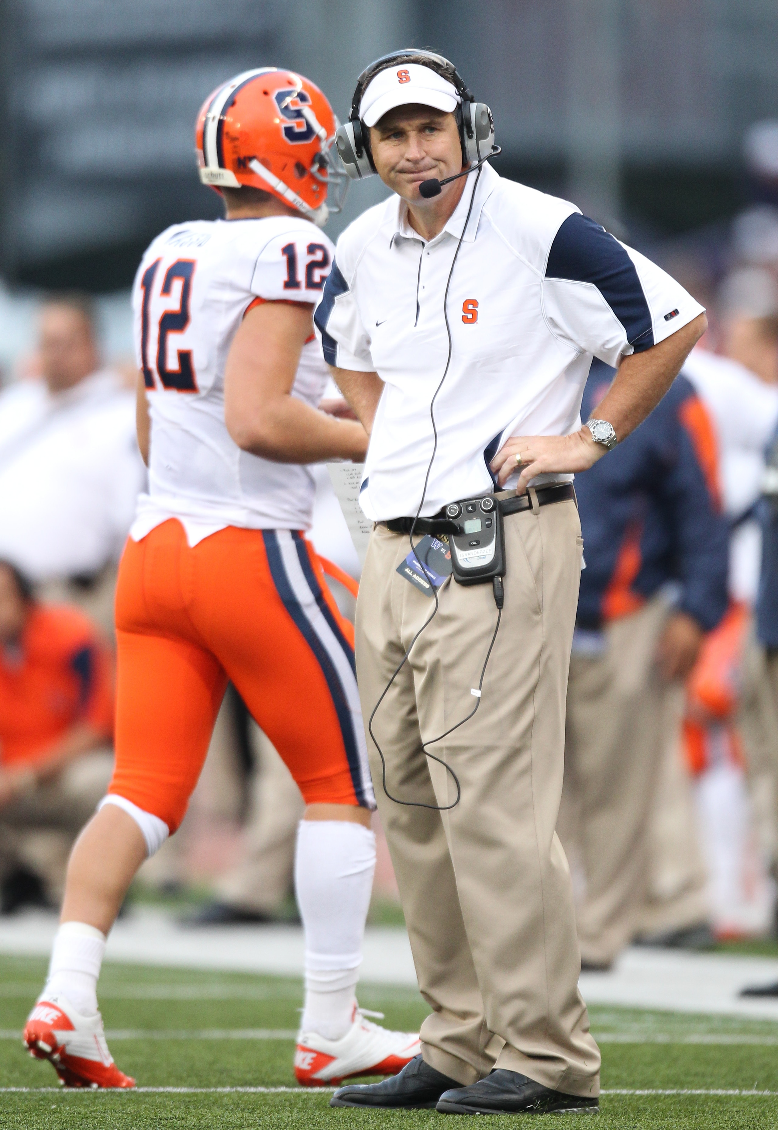 SEATTLE - SEPTEMBER 11:  Head coach Doug Marrone of the Syracuse Orange looks on as quarterback Ryan Nassib #12 comes off the field during the game against the Washington Huskies on September 11, 2010 at Husky Stadium in Seattle, Washington. (Photo by Ott