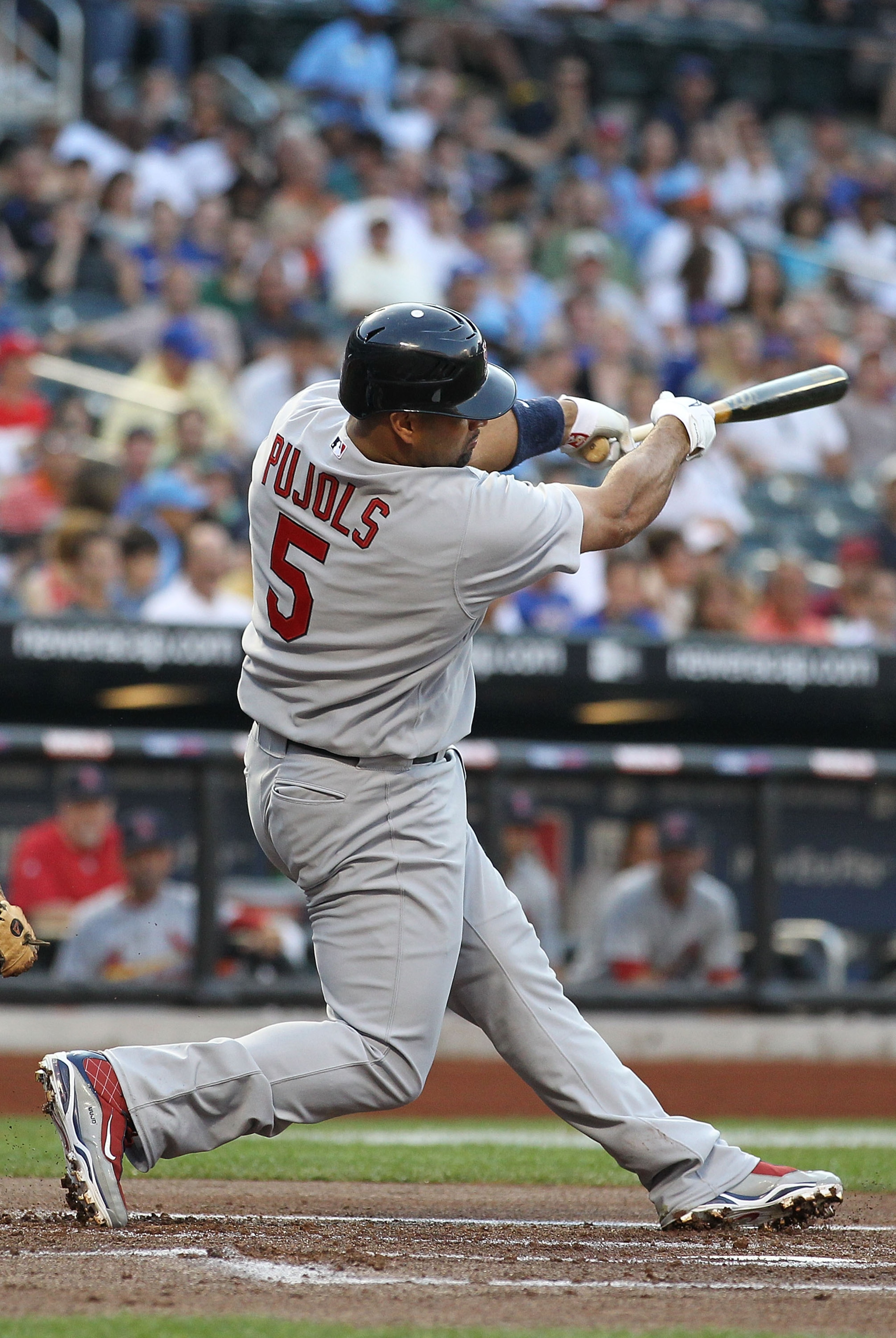 NEW YORK - JULY 27:  Albert Pujols #5 of the St. Louis Cardinals flies out against the New York Mets during their game on July 27, 2010 at Citi Field in the Flushing neighborhood of the Queens borough of New York City.  (Photo by Al Bello/Getty Images)