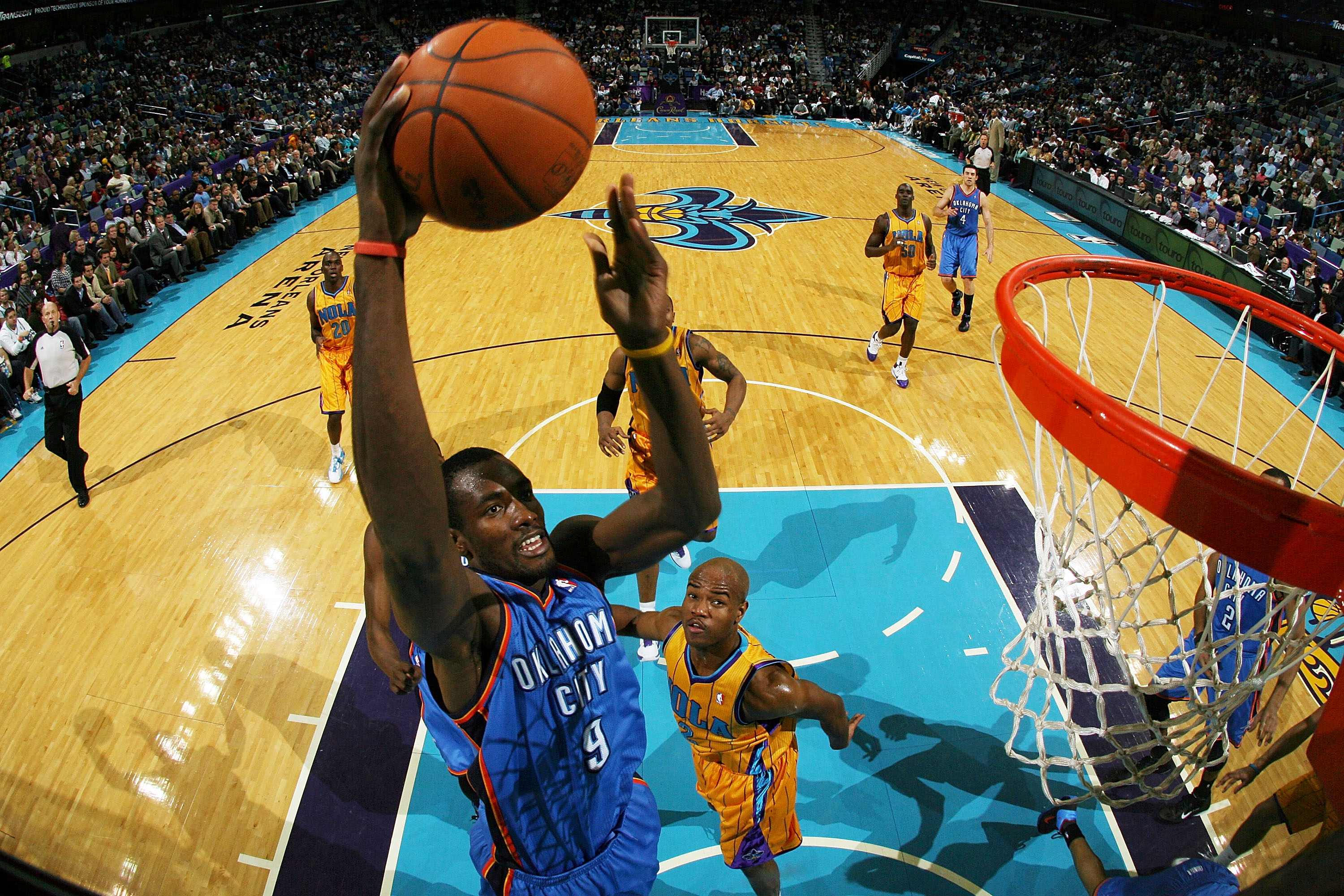NEW ORLEANS, LA - DECEMBER 10: Serge Ibaka #9  of the Oklahoma City Thunder dunks the ball over Jarrett Jack #2 of the New Orleans Hornets at New Orleans Arena on December 10, 2010 in New Orleans, Louisiana.    NOTE TO USER: User expressly acknowledges an