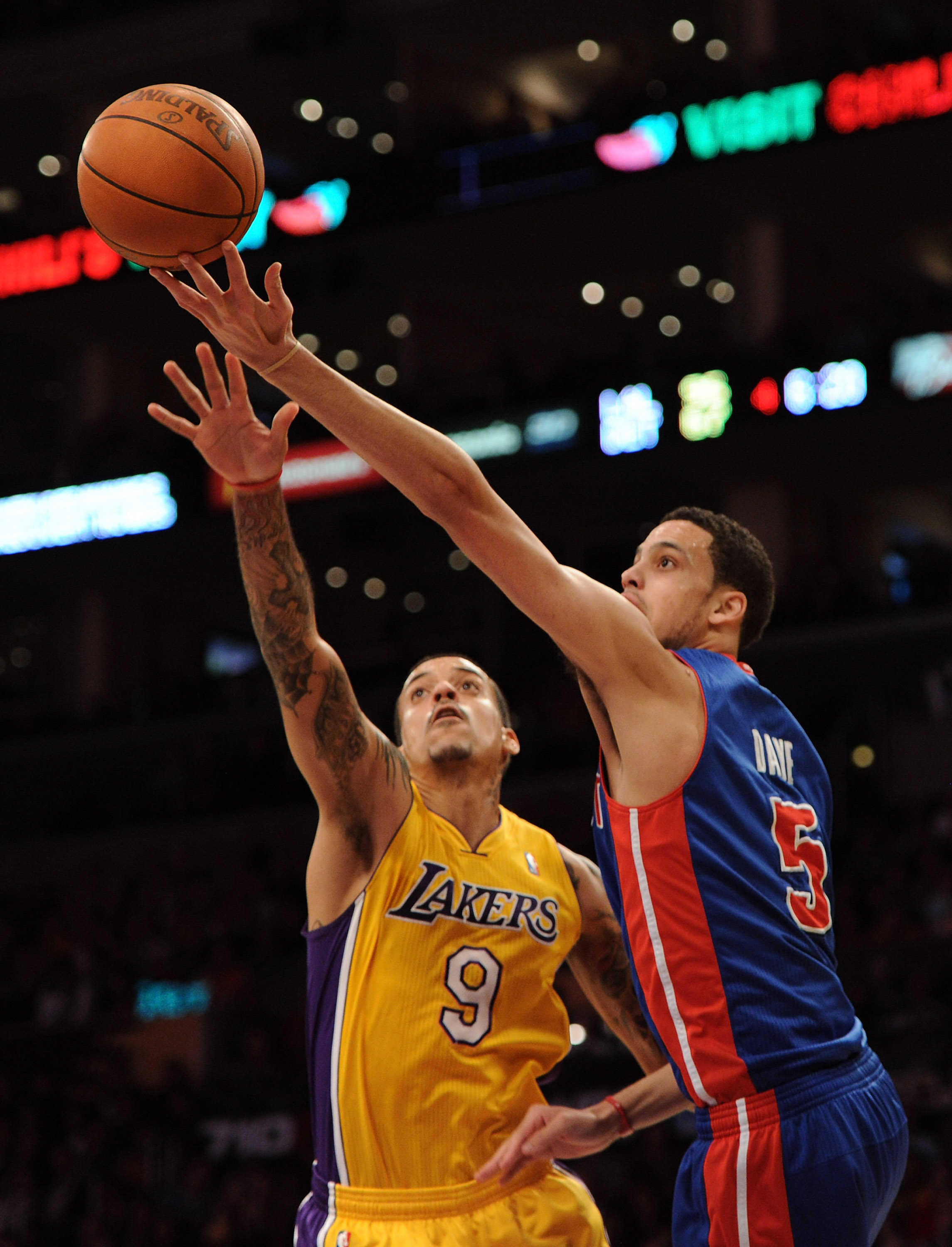LOS ANGELES, CA - JANUARY 04:  Austin Daye #5 of the Detroit Pistons goes for a layup in front of Matt Barnes #9 of the Los Angeles Lakers during a 108-83 Laker win at the Staples Center on January 4, 2011 in Los Angeles, California. NOTE TO USER: User ex