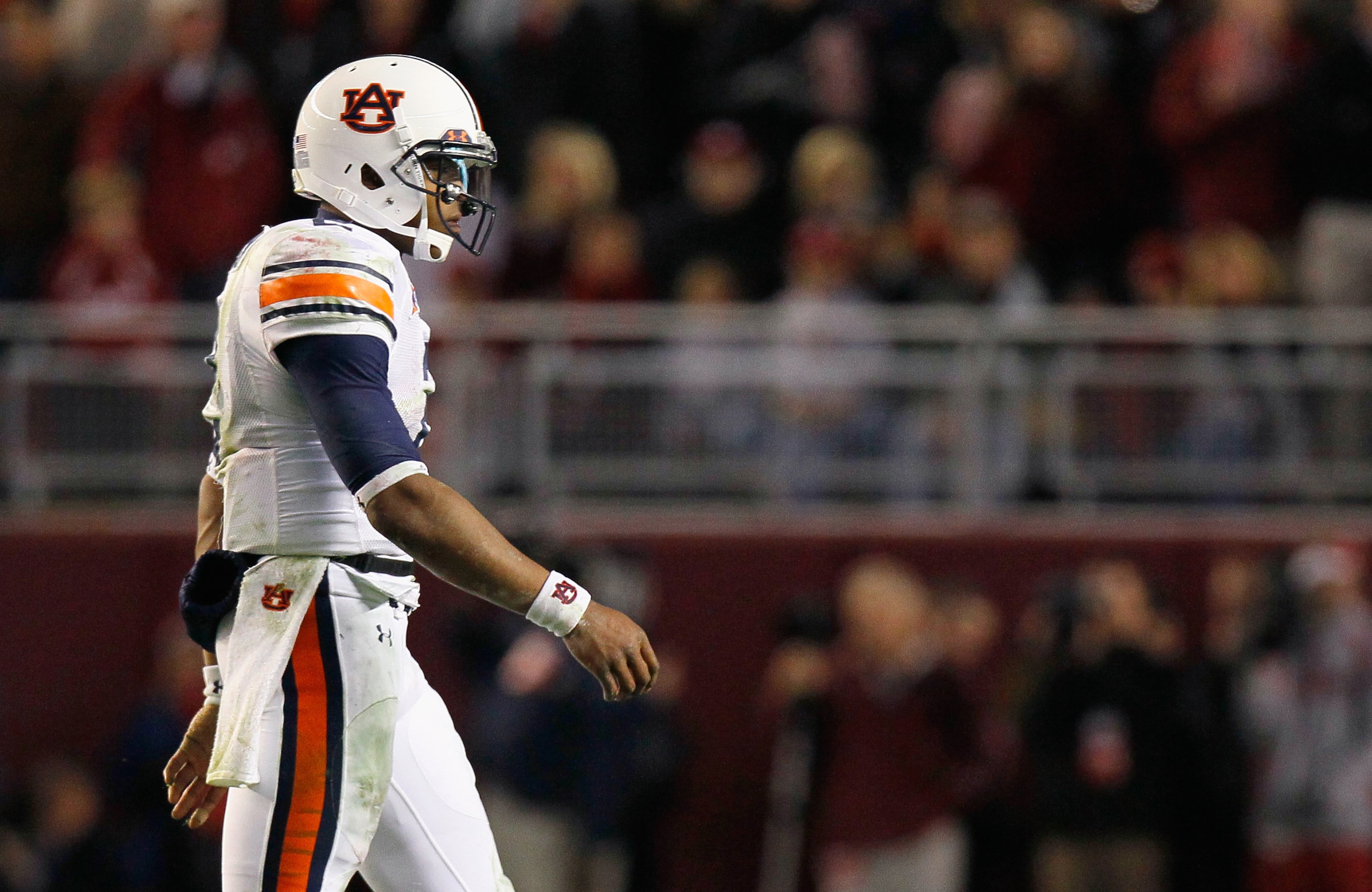 TUSCALOOSA, AL - NOVEMBER 26: Quarterback Cam Newton #2 of the Auburn Tigers walks back to the bench for a play call after a first down against the Alabama Crimson Tide at Bryant-Denny Stadium on November 26, 2010 in Tuscaloosa, Alabama. (Photo by Kevin TUSCALOOSA, AL - NOVEMBER 26: Quarterback Cam Newton #2 of the Auburn Tigers walks back to the bench for a play call after a first down against the Alabama Crimson Tide at Bryant-Denny Stadium on November 26, 2010 in Tuscaloosa, Alabama. (Photo by Kevin