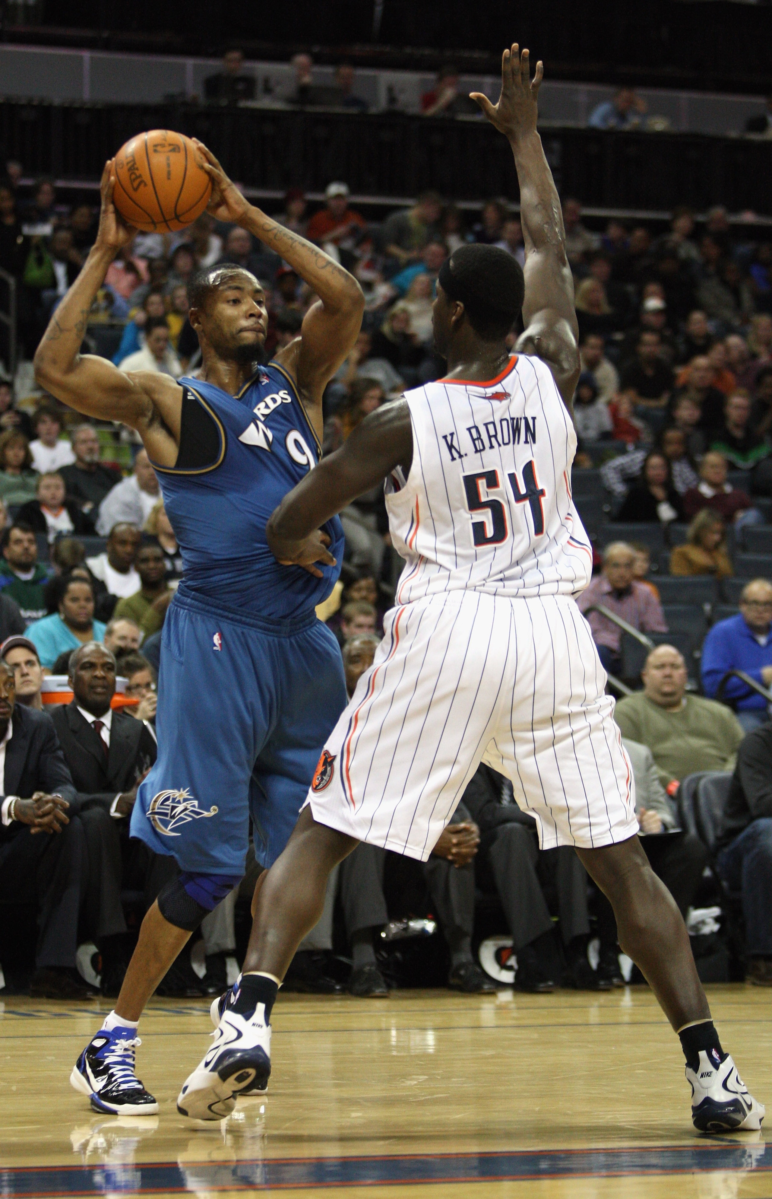 CHARLOTTE, NC - JANUARY 08: Rashard Lewis #9 of the Washington Wizards looks to pass the ball around Kwame Brown #54 of the Charlotte Bobcats during their game at Time Warner Cable Arena on January 8, 2011 in Charlotte, North Carolina. NOTE TO USER: User CHARLOTTE, NC - JANUARY 08: Rashard Lewis #9 of the Washington Wizards looks to pass the ball around Kwame Brown #54 of the Charlotte Bobcats during their game at Time Warner Cable Arena on January 8, 2011 in Charlotte, North Carolina. NOTE TO USER: User