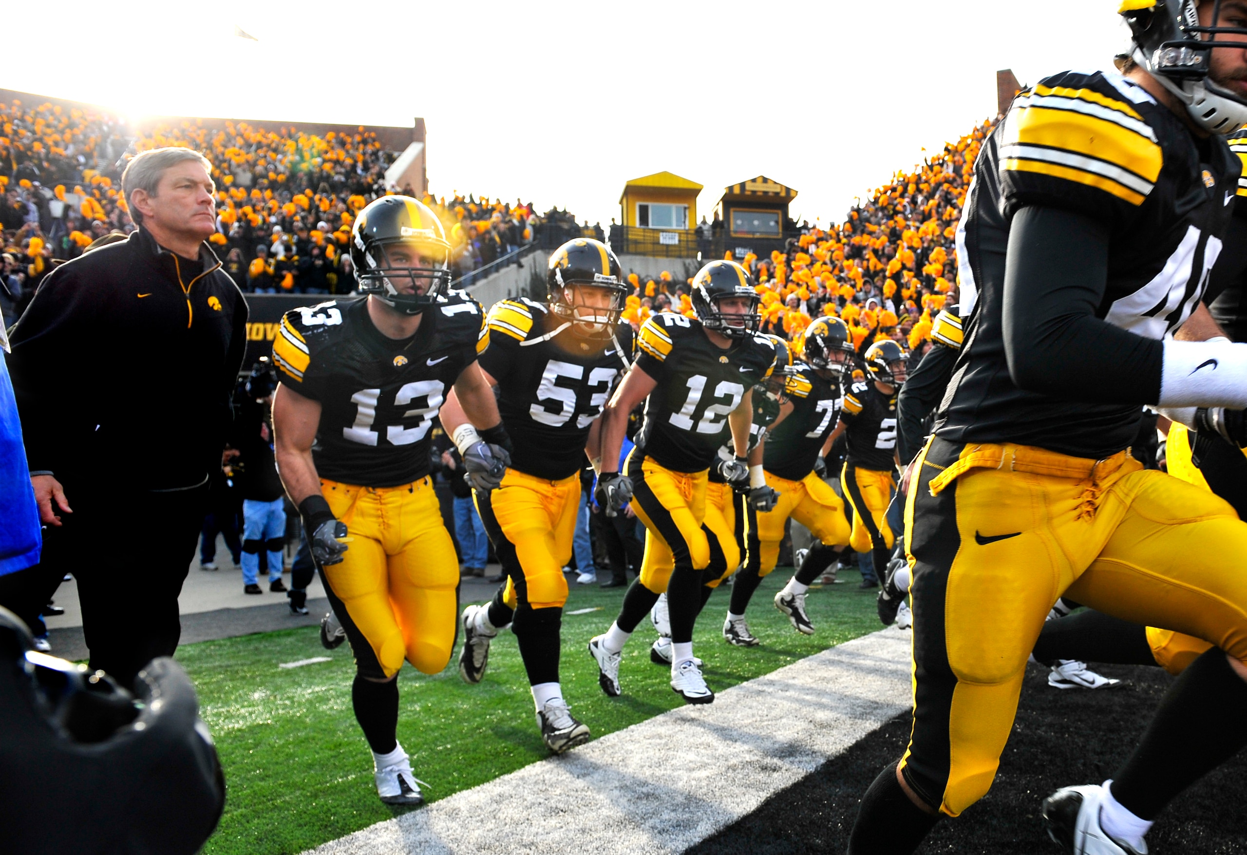 IOWA CITY, IA - NOVEMBER 20: University of Iowa Hawkeyes head coach Kirk Ferentz takes the field with his team for the Ohio State Buckeyes NCAA college football game at Kinnick Stadium on November 20, 2010 in Iowa City, Iowa. Ohio State won 20-17 over Io IOWA CITY, IA - NOVEMBER 20: University of Iowa Hawkeyes head coach Kirk Ferentz takes the field with his team for the Ohio State Buckeyes NCAA college football game at Kinnick Stadium on November 20, 2010 in Iowa City, Iowa. Ohio State won 20-17 over Io