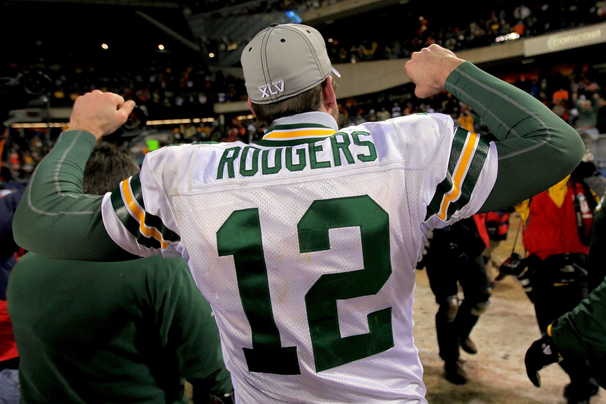 CHICAGO, IL - JANUARY 23:  Quarterback Aaron Rodgers #12 of the Green Bay Packers celebrates the Packers 21-14 victory against the Chicago Bears in the NFC Championship Game at Soldier Field on January 23, 2011 in Chicago, Illinois.  (Photo by Doug Pensin