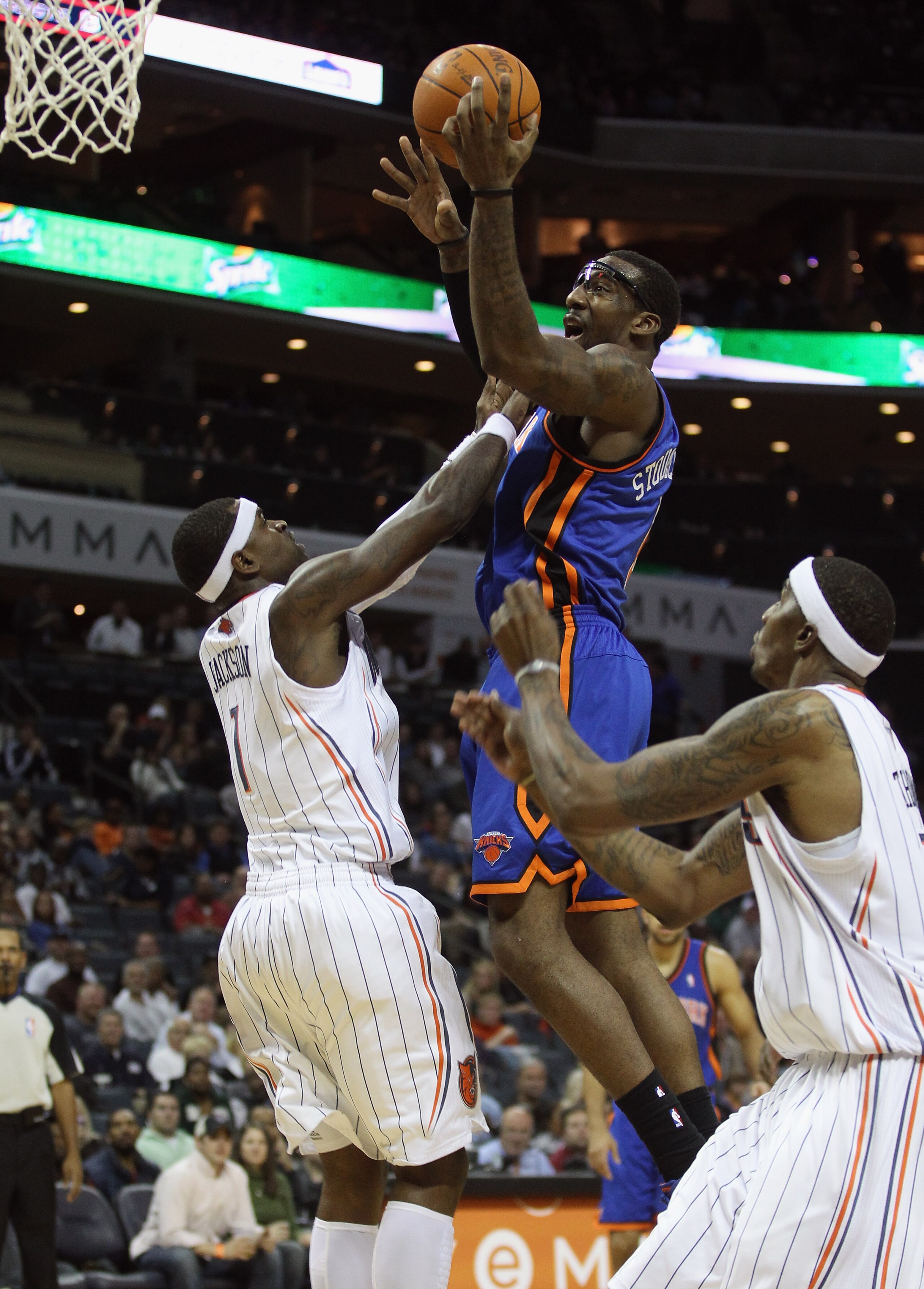 CHARLOTTE, NC - NOVEMBER 24: Amare Stoudemire #1 of the New York Knicks drives to the basket over Stephen Jackson #1 of the Charlotte Bobcats at Time Warner Cable Arena on November 24, 2010 in Charlotte, North Carolina. NOTE TO USER: User expressly ackn CHARLOTTE, NC - NOVEMBER 24: Amare Stoudemire #1 of the New York Knicks drives to the basket over Stephen Jackson #1 of the Charlotte Bobcats at Time Warner Cable Arena on November 24, 2010 in Charlotte, North Carolina. NOTE TO USER: User expressly ackn