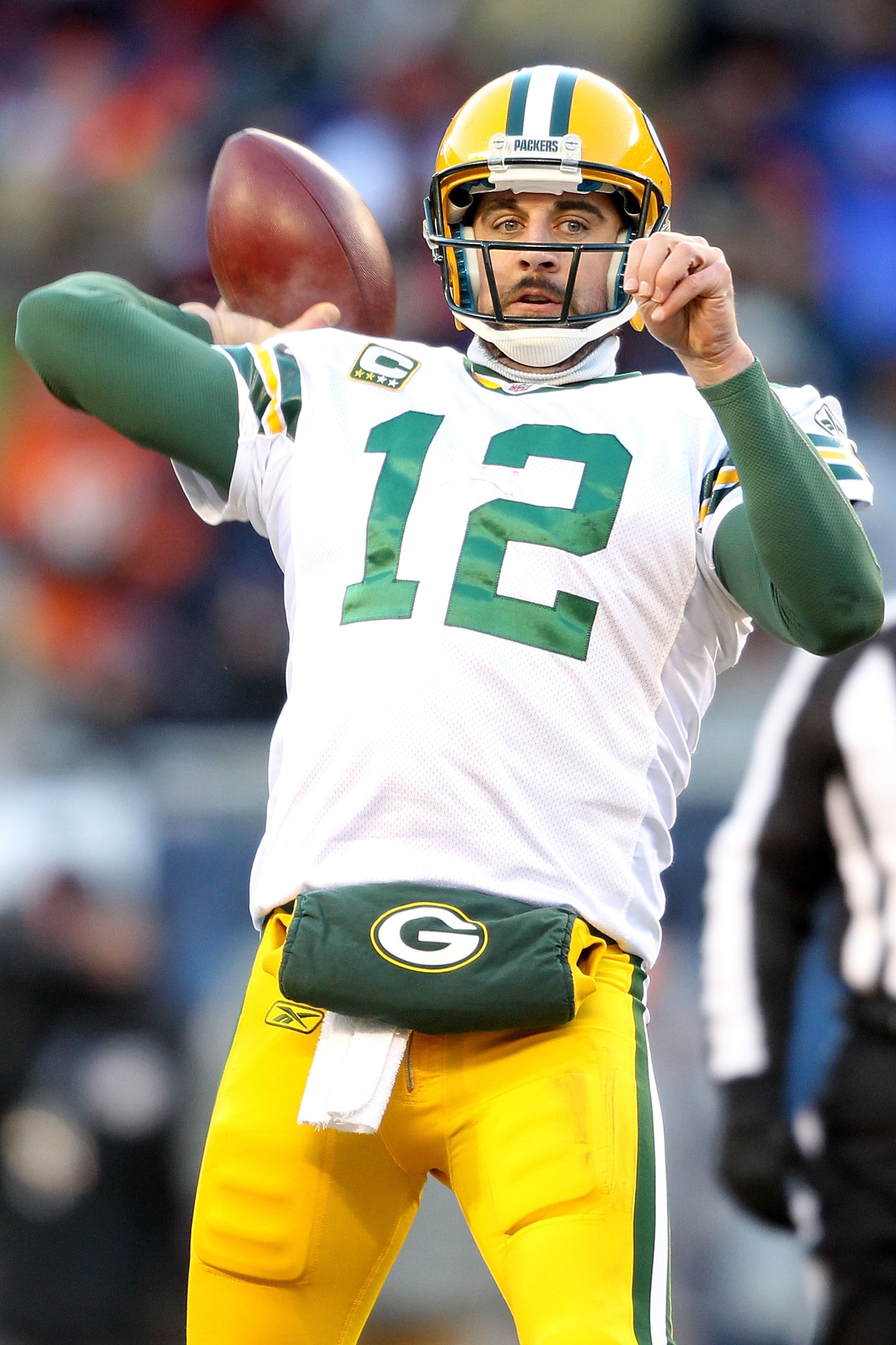 CHICAGO, IL - JANUARY 23:  Quarterback Aaron Rodgers #12 of the Green Bay Packers throws a pass in the third quarter against Chicago Bears in the NFC Championship Game at Soldier Field on January 23, 2011 in Chicago, Illinois.  (Photo by Andy Lyons/Getty