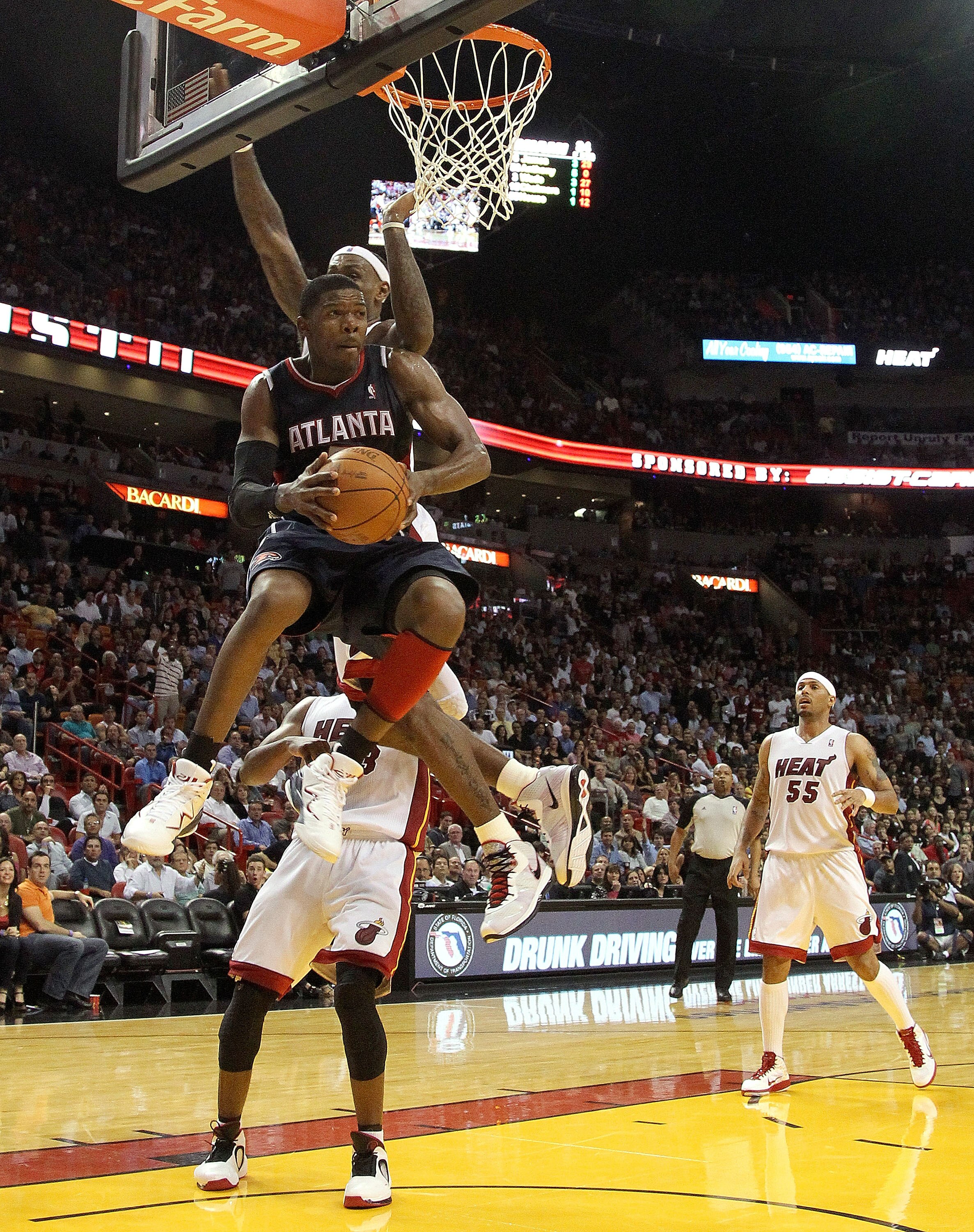 MIAMI, FL - JANUARY 18:  Joe Johnson #2 of the Atlanta Hawks passes out of traffic during a game against the Miami Heat at American Airlines Arena on January 18, 2011 in Miami, Florida. NOTE TO USER: User expressly acknowledges and agrees that, by downloa