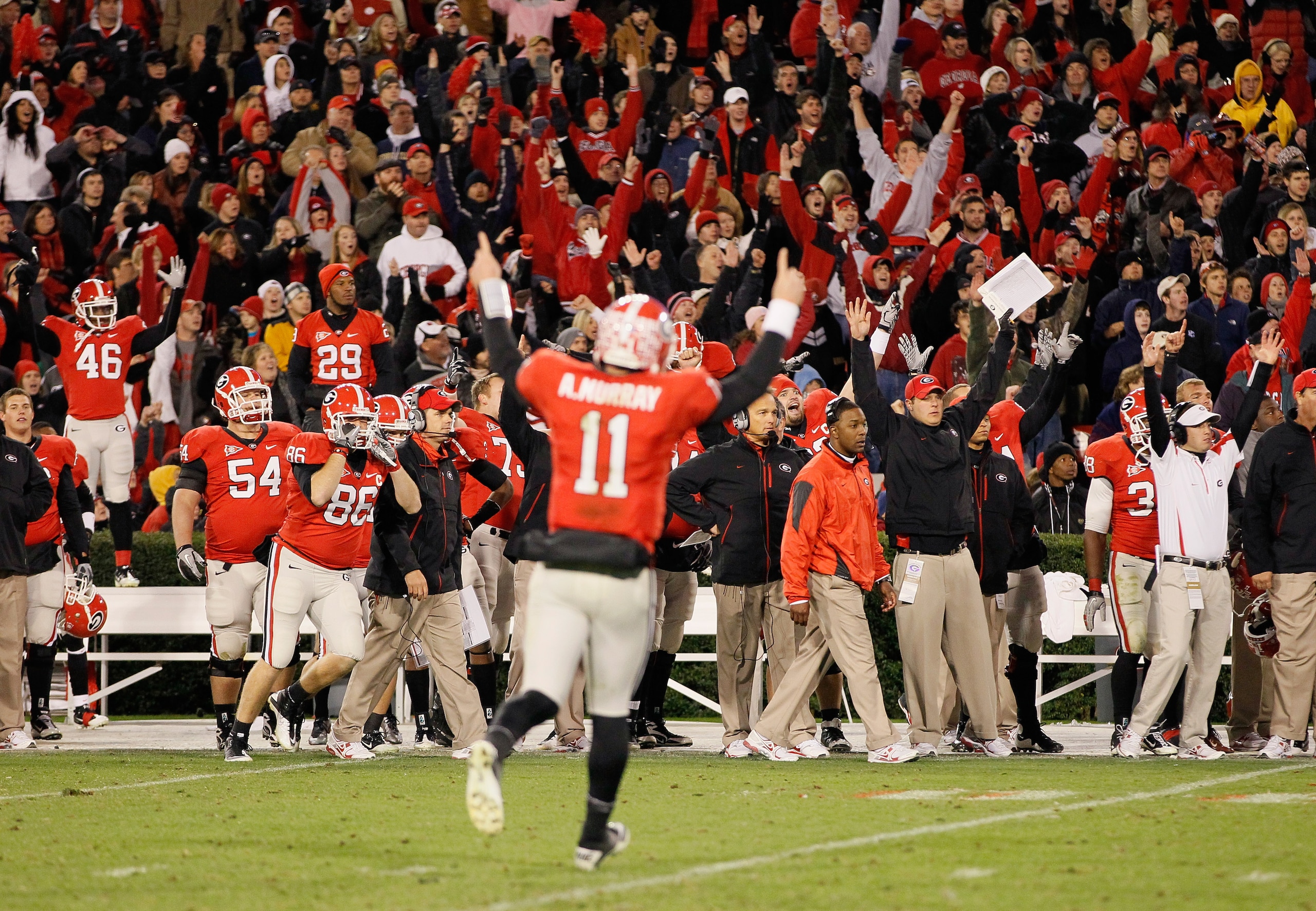 ATHENS, GA - NOVEMBER 27: The Georgia Bulldogs and quarterback Aaron Murray #11 react after a touchdown in the final minutes of play against the Georgia Tech Yellow Jackets at Sanford Stadium on November 27, 2010 in Athens, Georgia. (Photo by Kevin C. C ATHENS, GA - NOVEMBER 27: The Georgia Bulldogs and quarterback Aaron Murray #11 react after a touchdown in the final minutes of play against the Georgia Tech Yellow Jackets at Sanford Stadium on November 27, 2010 in Athens, Georgia. (Photo by Kevin C. C
