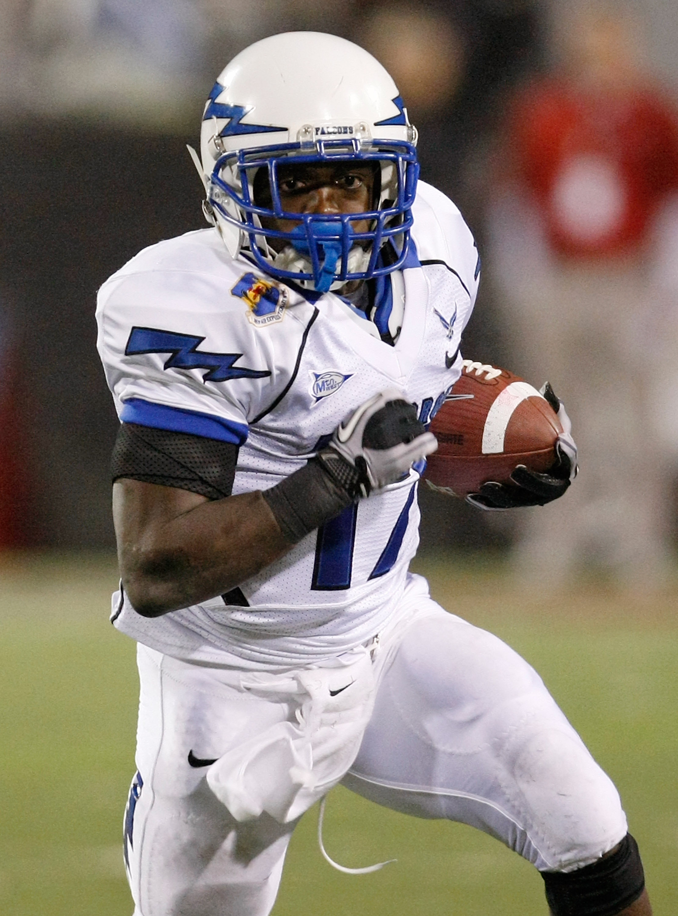 LAS VEGAS - NOVEMBER 18: Asher Clark #17 of the Air Force Falcons runs for yardage against the UNLV Rebels during their game at Sam Boyd Stadium November 18, 2010 in Las Vegas, Nevada. Air Force won 35-20. (Photo by Ethan Miller/Getty Images)