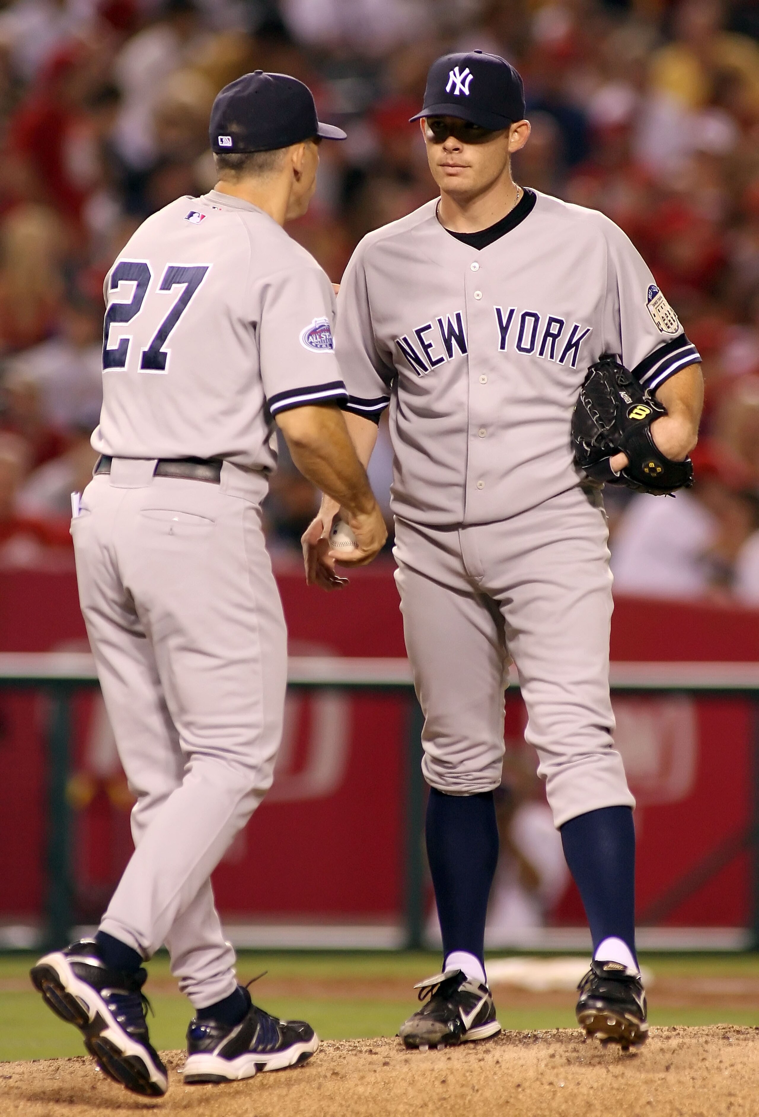 ANAHEIM, CA - AUGUST 08: Starting pitcher Ian Kennedy #31 of the New York Yankees is removed by manager Joe Girardi during the game against the Los Angeles Angels of Anaheim at Angel Stadium on August 8, 2008 in Anaheim, California. (Photo by Christian ANAHEIM, CA - AUGUST 08: Starting pitcher Ian Kennedy #31 of the New York Yankees is removed by manager Joe Girardi during the game against the Los Angeles Angels of Anaheim at Angel Stadium on August 8, 2008 in Anaheim, California. (Photo by Christian