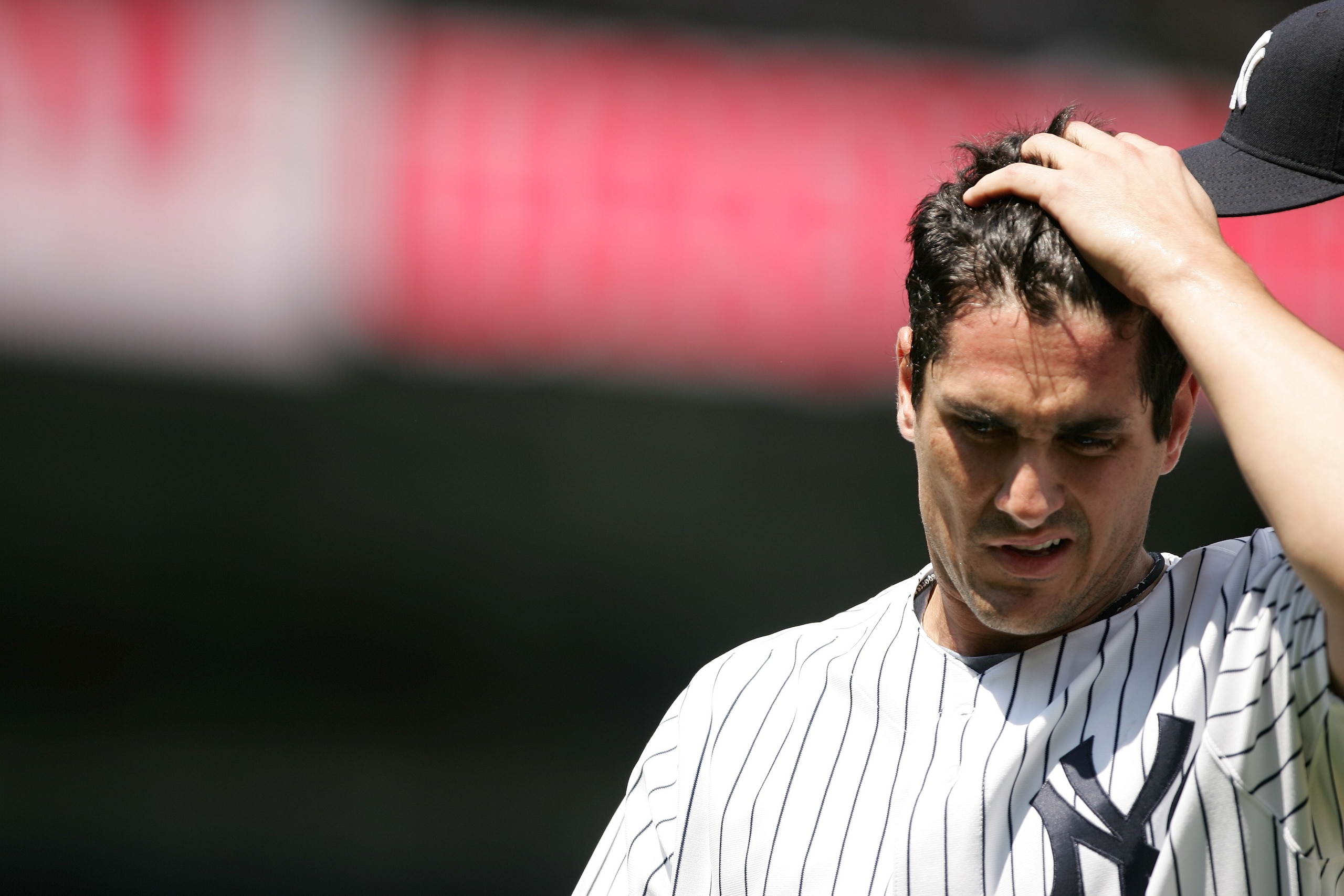 NEW YORK - JUNE 22: Carl Pavano #45 of the New York Yankees runs his fingers through his hair against the Tampa Bay Devil Rays on June 22, 2005 at Yankee Stadium in the Bronx, New York. The Devil Rays won 5-3. (Photo by Al Bello/Getty Images) NEW YORK - JUNE 22: Carl Pavano #45 of the New York Yankees runs his fingers through his hair against the Tampa Bay Devil Rays on June 22, 2005 at Yankee Stadium in the Bronx, New York. The Devil Rays won 5-3. (Photo by Al Bello/Getty Images)