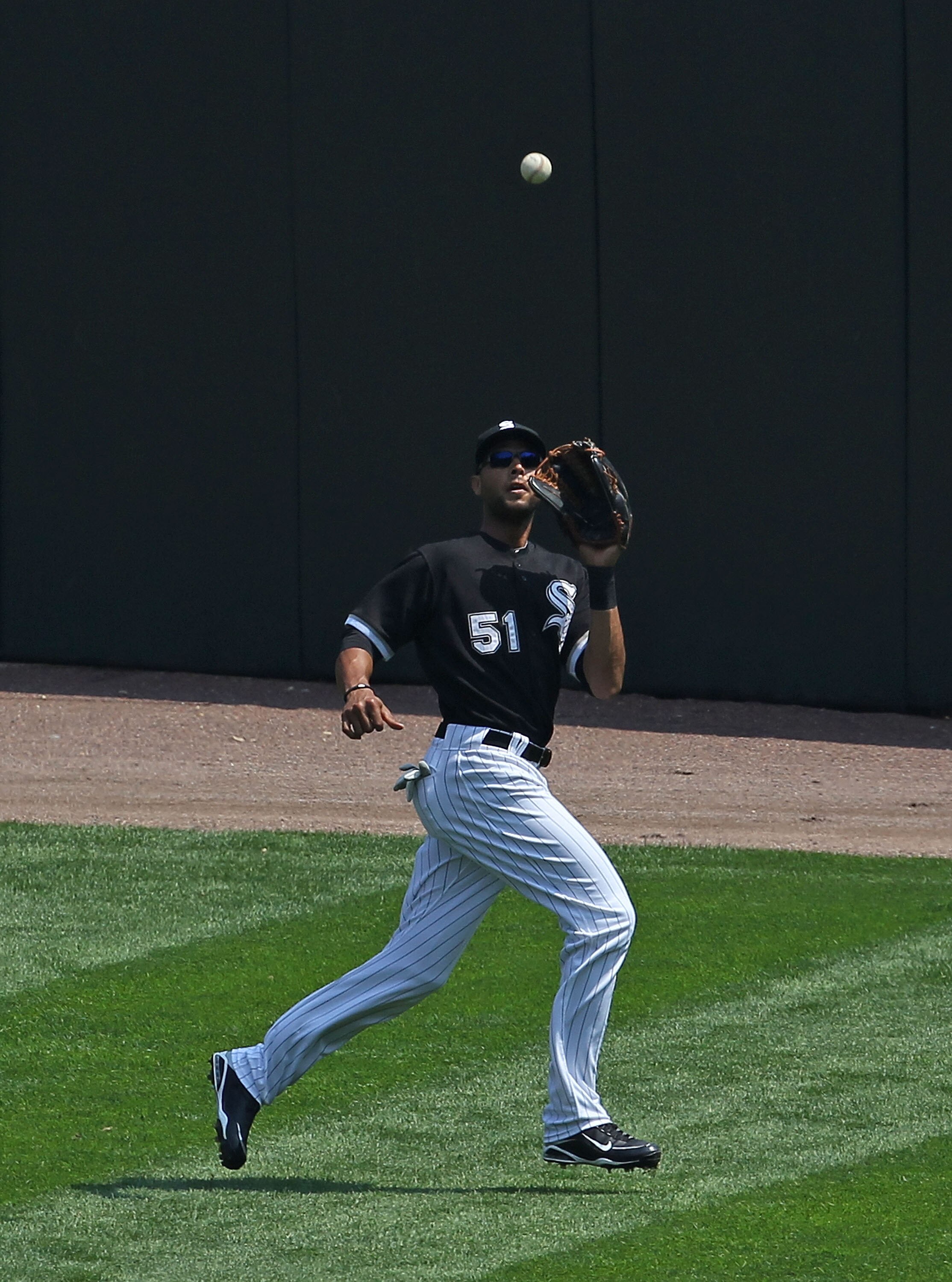 CHICAGO - AUGUST 01: Alex Rios #51 of the Chicago White Sox makes a catch against the Oakland Athletics at U.S. Cellular Field on August 1, 2010 in Chicago, Illinois. The White Sox defeated the Athletics 4-1. (Photo by Jonathan Daniel/Getty Images)