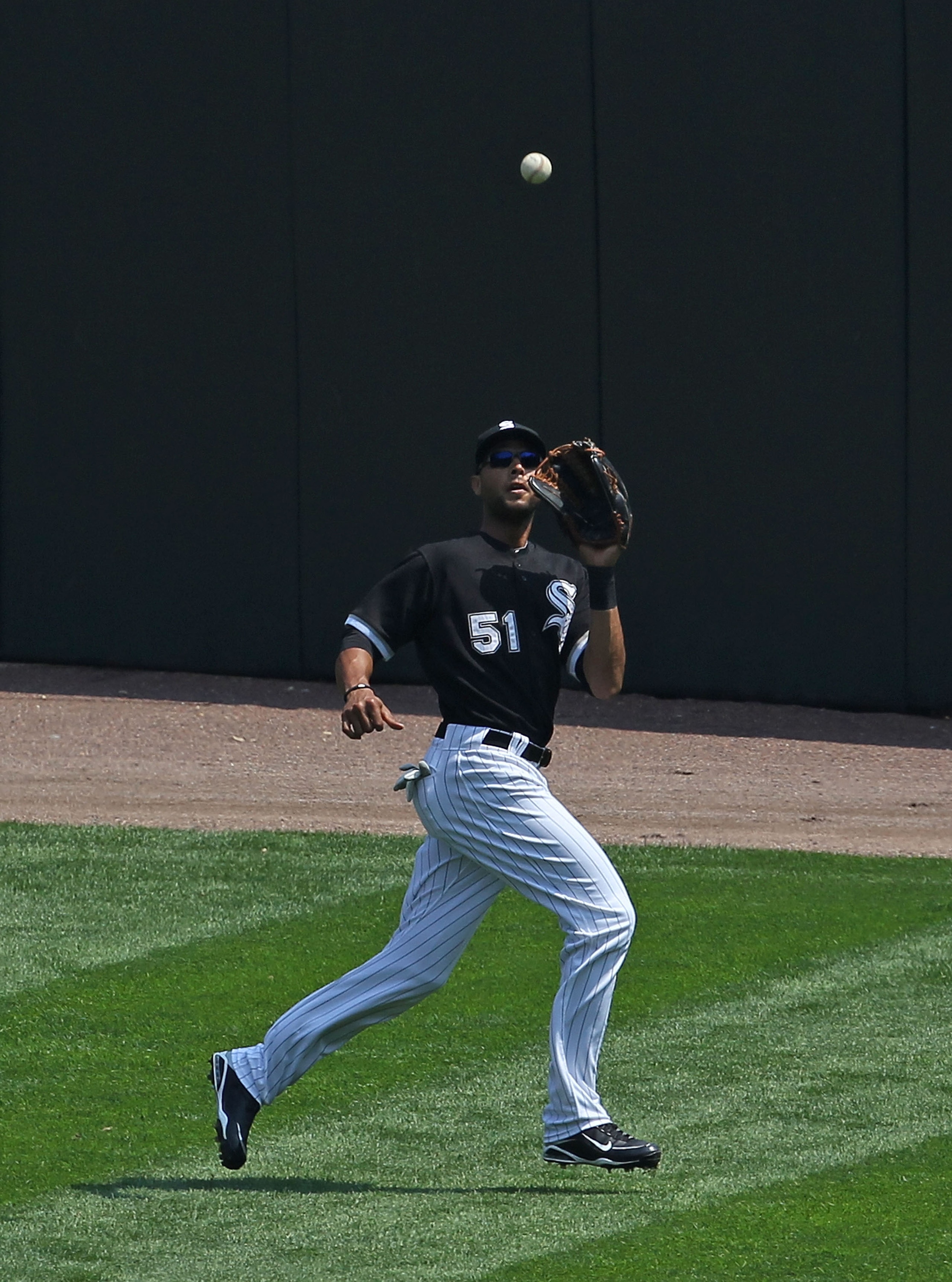 CHICAGO - AUGUST 01: Alex Rios #51 of the Chicago White Sox makes a catch against the Oakland Athletics at U.S. Cellular Field on August 1, 2010 in Chicago, Illinois. The White Sox defeated the Athletics 4-1. (Photo by Jonathan Daniel/Getty Images)