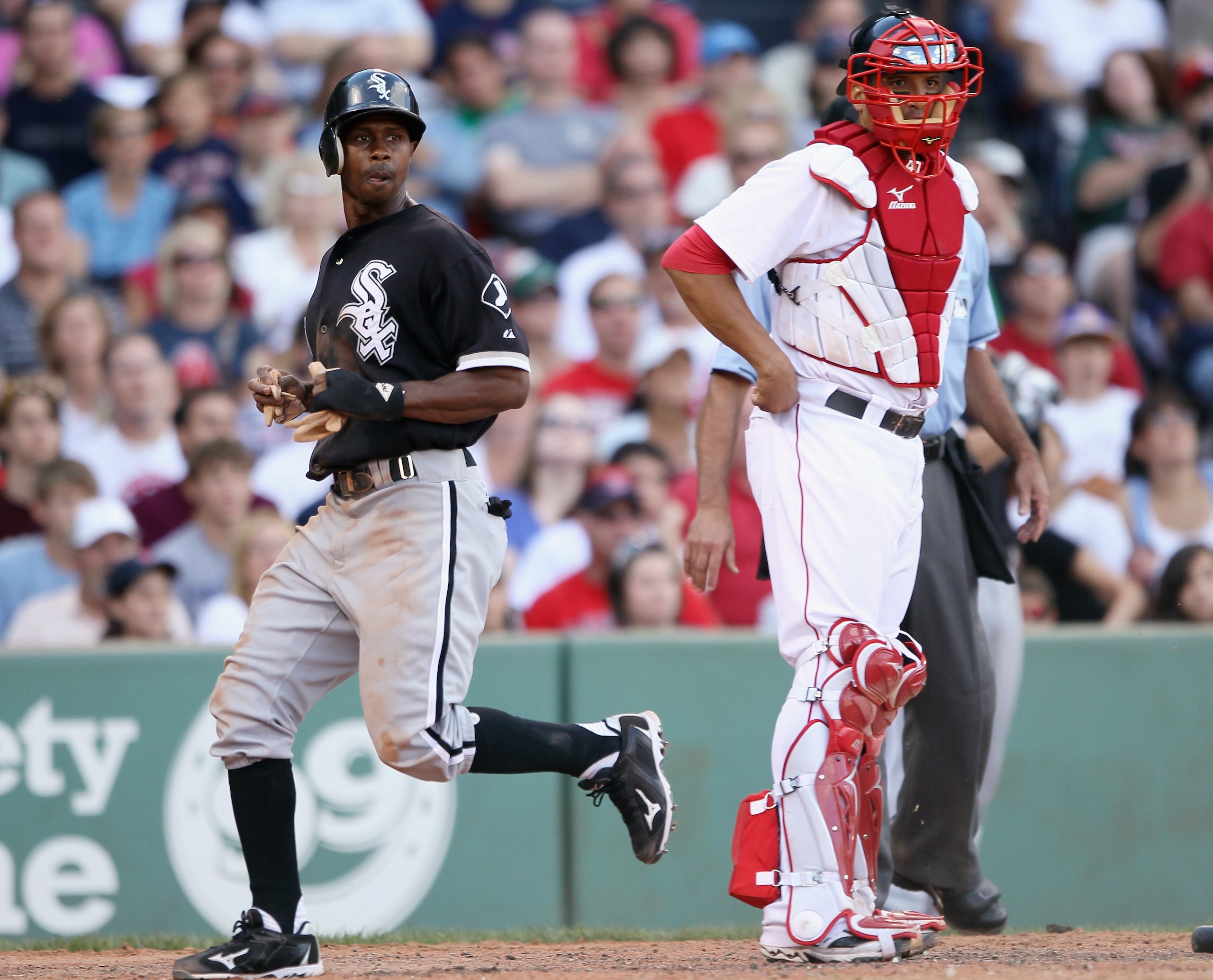 BOSTON - SEPTEMBER 05:  Juan Pierre #1 of the Chicago White Sox scores in the seventh inning as catcher Victor Martinez #41 of the Boston Red Sox defends on September 5, 2010 at Fenway Park in Boston, Massachusetts.  (Photo by Elsa/Getty Images)