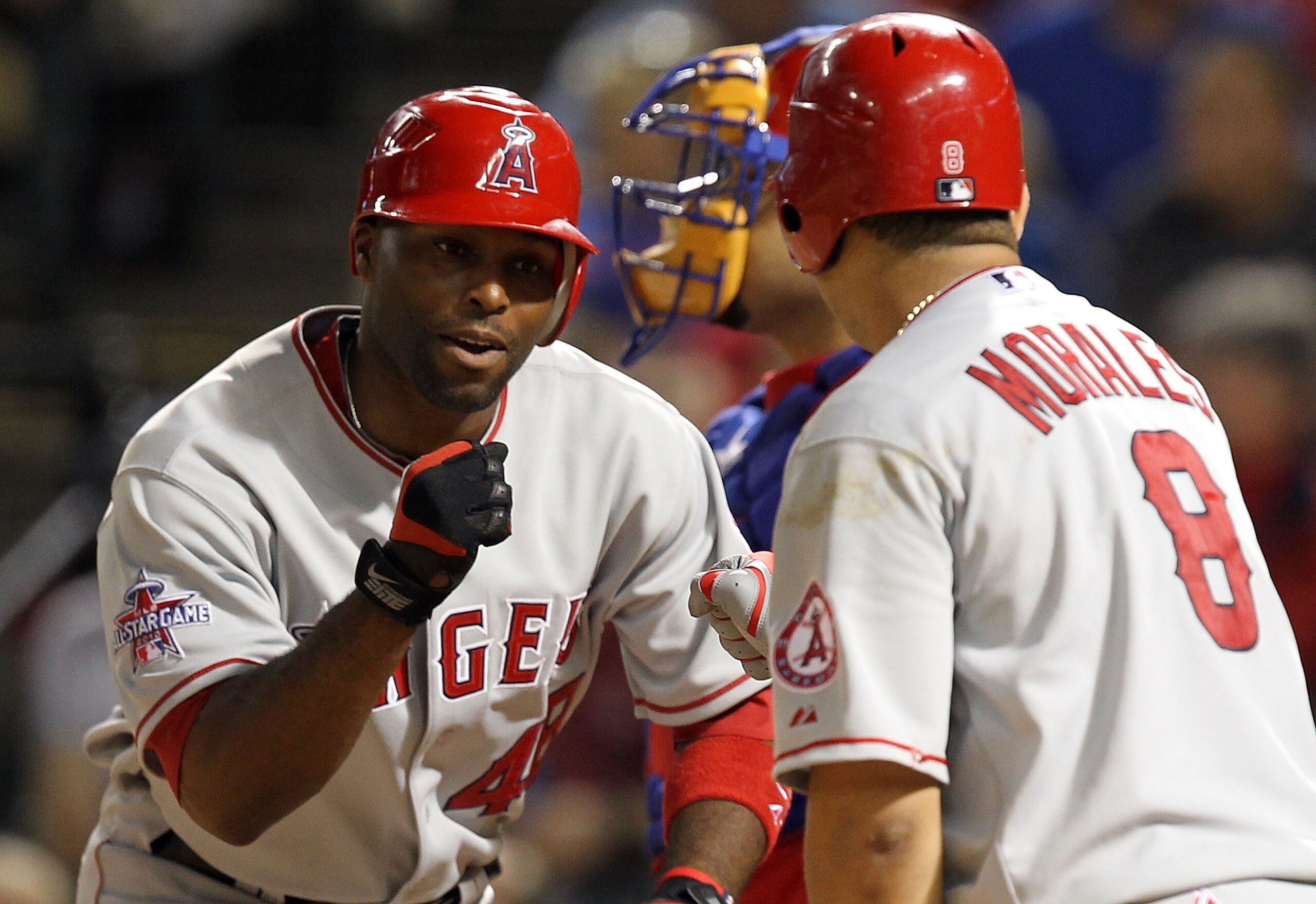 ARLINGTON, TX - MAY 17: Torii Hunter #48 of the Los Angeles Angels of Anaheim celebrates a solo homerun with Kendry Morales #8 against the Texas Rangers on May 17, 2010 at Rangers Ballpark in Arlington, Texas. (Photo by Ronald Martinez/Getty Images)