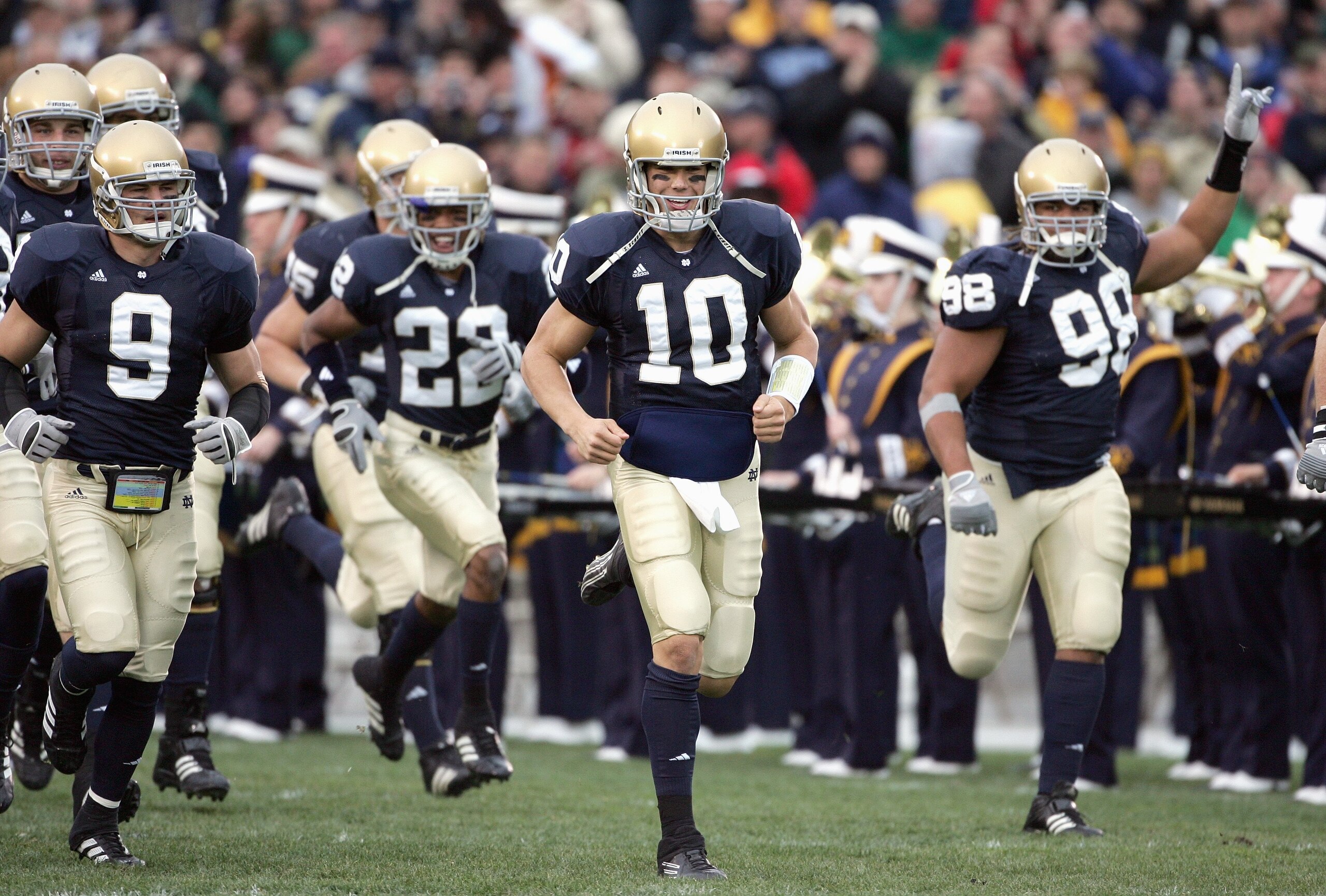 SOUTH BEND, IN - NOVEMBER 4: Quarterback Brady Quinn #10 and Tom Zbikowski #9 of the Notre Dame Fighting Irish run onto the field before the game against the North Carolina Tar Heels on November 4, 2006 at Notre Dame Stadium in South Bend, Indiana. (Photo