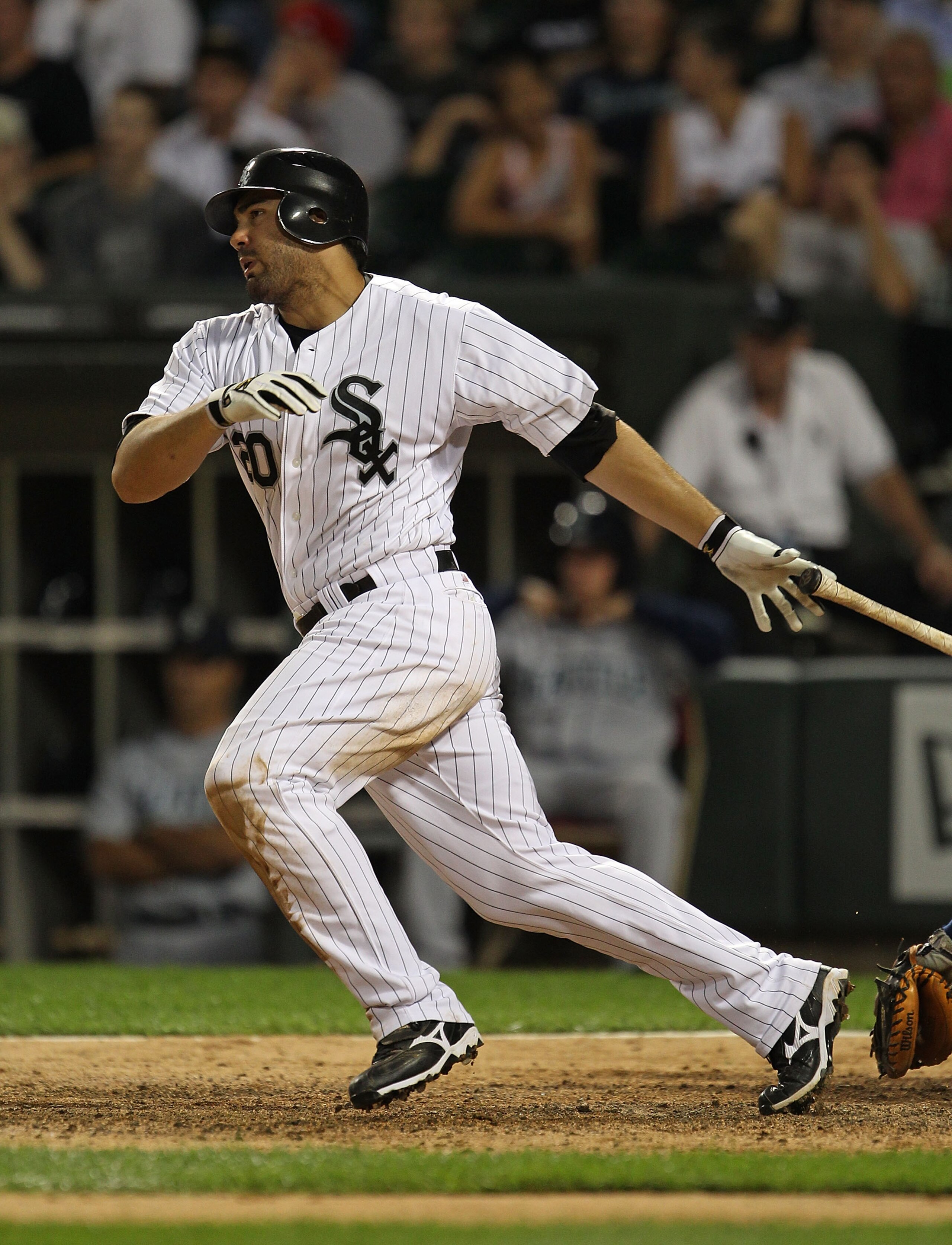 CHICAGO - JULY 26: Carlos Quentin #20 of the Chicago White Sox hits the ball against the Seattle Mariners at U.S. Cellular Field on July 26, 2010 in Chicago, Illinois. The White Sox defeated the Mariners 6-1. (Photo by Jonathan Daniel/Getty Images)