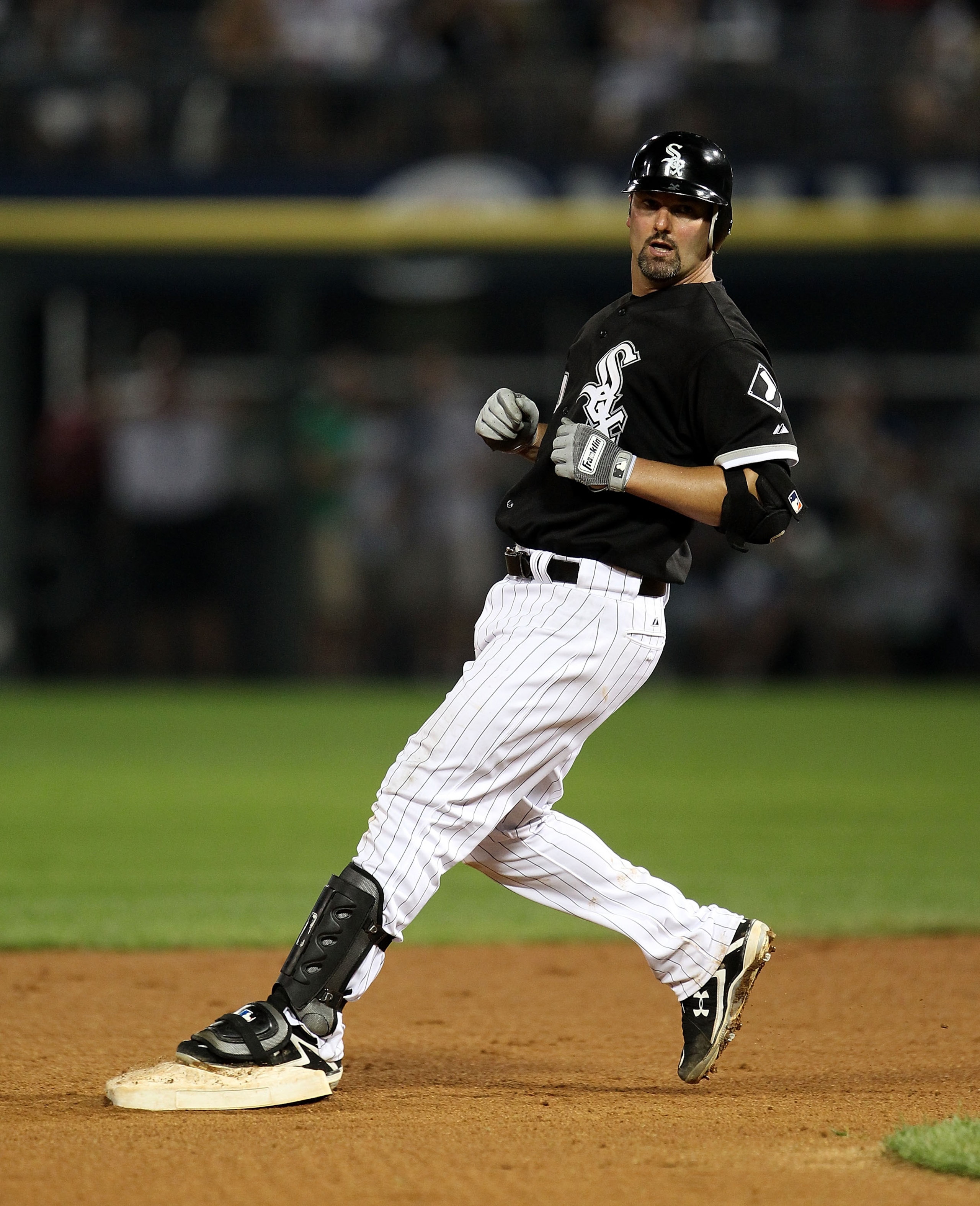 CHICAGO - AUGUST 10: Paul Konerko #14 of the Chicago White Sox stops at 2nd base after hitting a double against the Minnesota Twins at U.S. Cellular Field on August 10, 2010 in Chicago, Illinois. The Twins defeated the White Sox 12-6. (Photo by Jonathan D