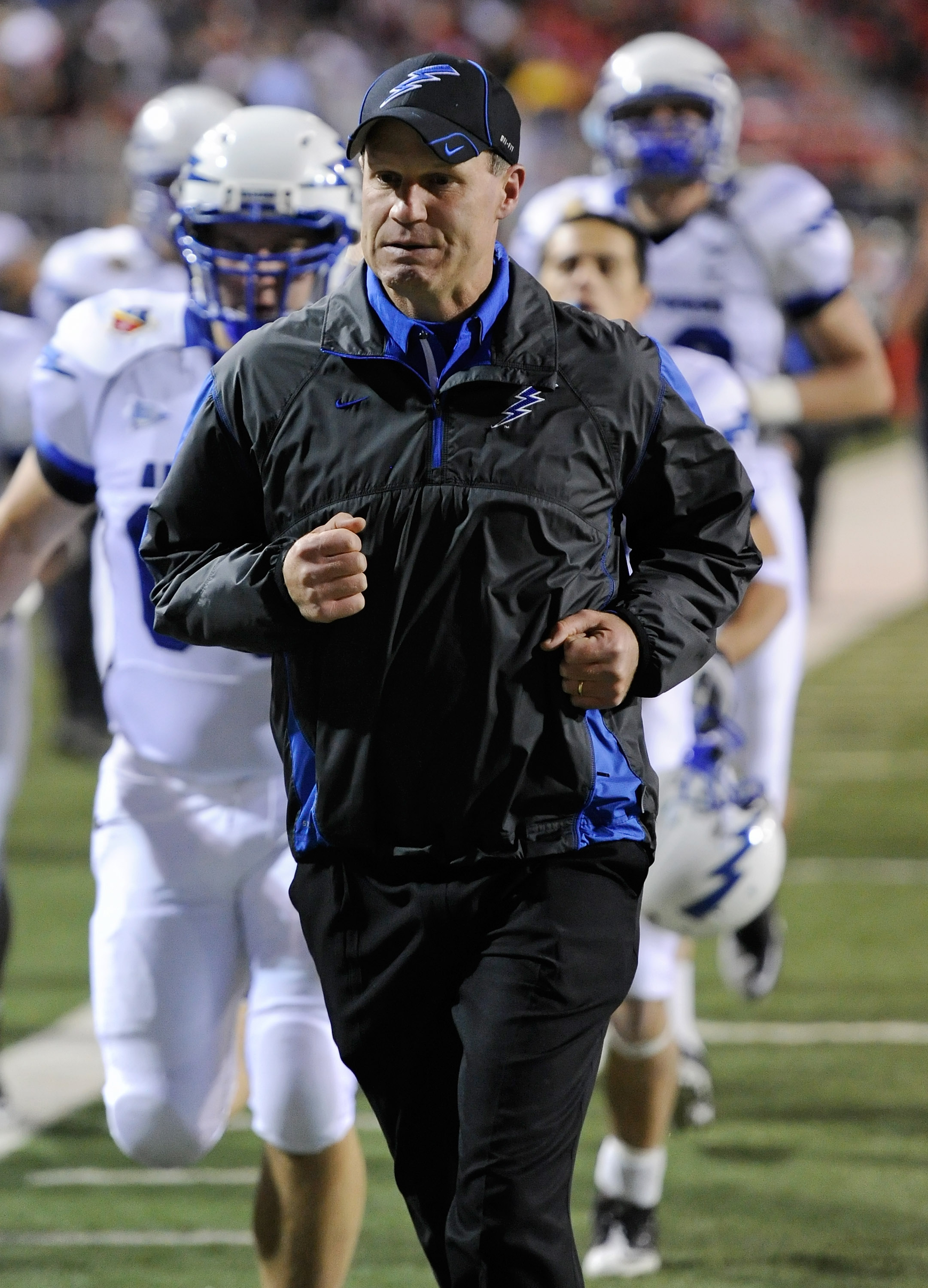 LAS VEGAS - NOVEMBER 18: Head coach Troy Calhoun of the Air Force Falcons runs off the field at halftime during a game against the UNLV Rebels at Sam Boyd Stadium November 18, 2010 in Las Vegas, Nevada. Air Force won 35-20. (Photo by Ethan Miller/Getty