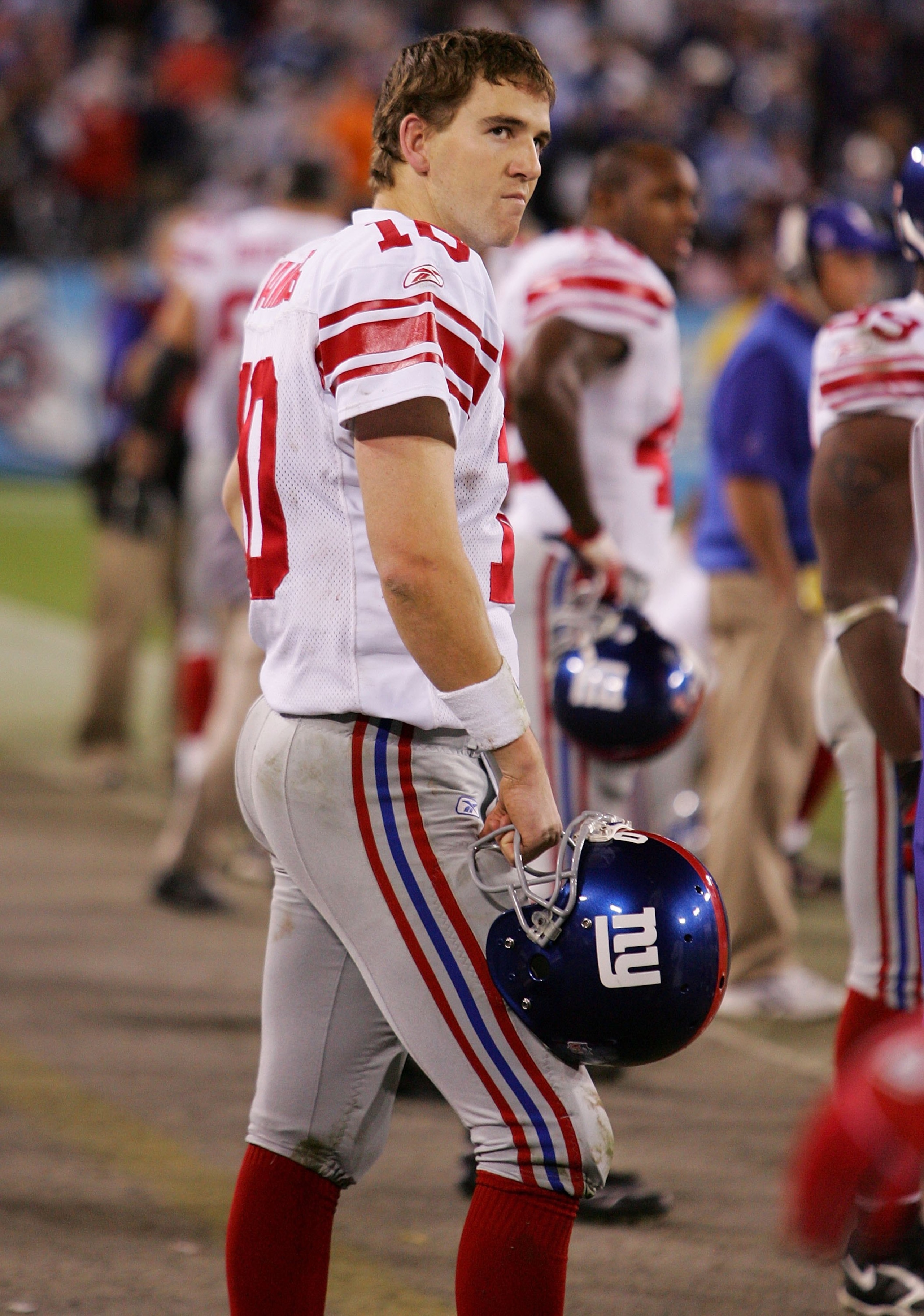 NASHVILLE, TN - NOVEMBER 26:  Eli Manning #10 of the New York Giants stands on the sideline after throwing a fourth quarter interception against the Tennessee Titans during their game on November 26, 2006 at LP Field in Nashville, Tennessee.  (Photo by Ji