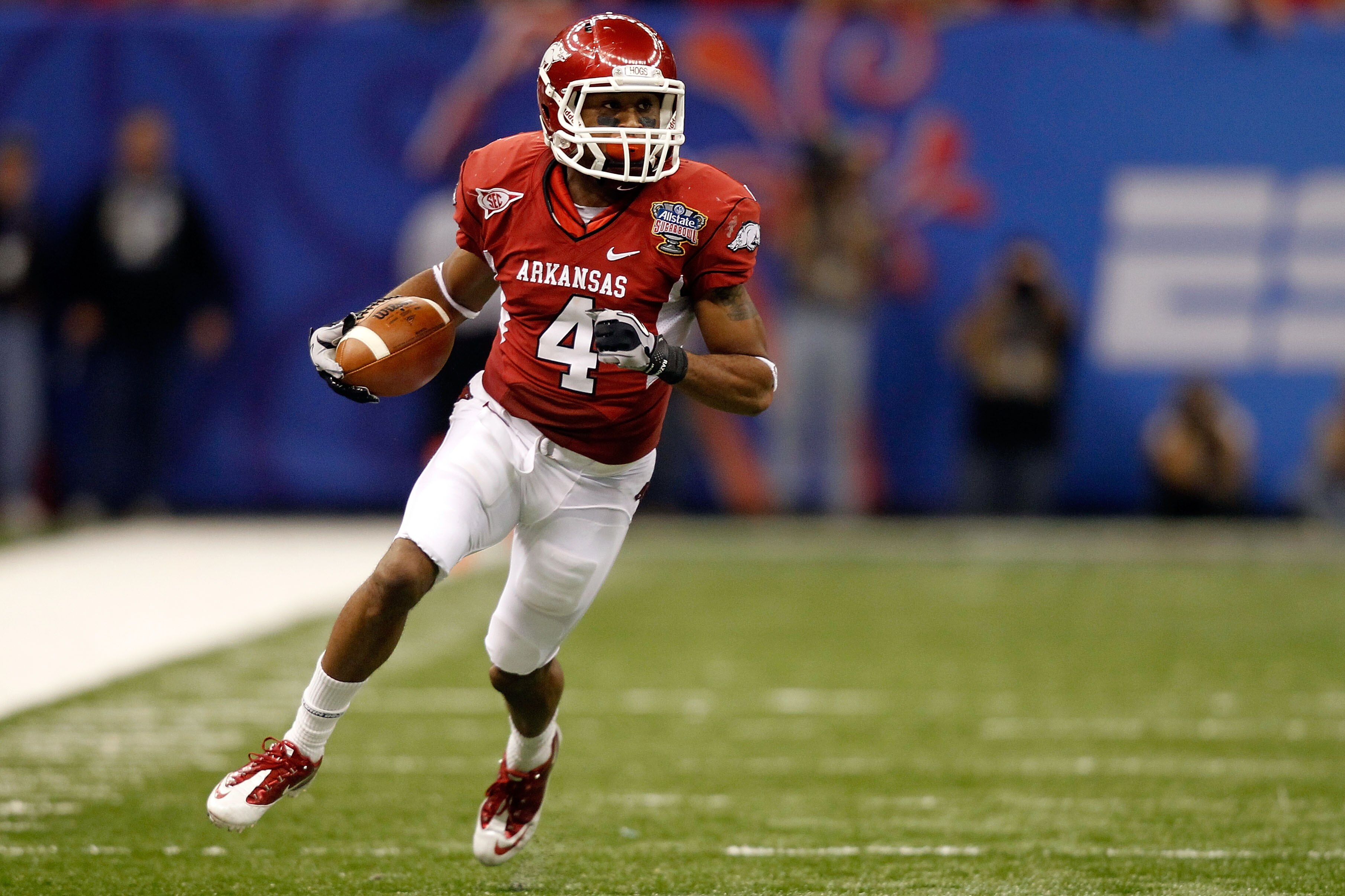 NEW ORLEANS, LA - JANUARY 04: Jarius Wright #4 of the Arkansas Razorbacks runs after a catch against the Ohio State Buckeyes during the Allstate Sugar Bowl at the Louisiana Superdome on January 4, 2011 in New Orleans, Louisiana. (Photo by Matthew Stockm NEW ORLEANS, LA - JANUARY 04: Jarius Wright #4 of the Arkansas Razorbacks runs after a catch against the Ohio State Buckeyes during the Allstate Sugar Bowl at the Louisiana Superdome on January 4, 2011 in New Orleans, Louisiana. (Photo by Matthew Stockm