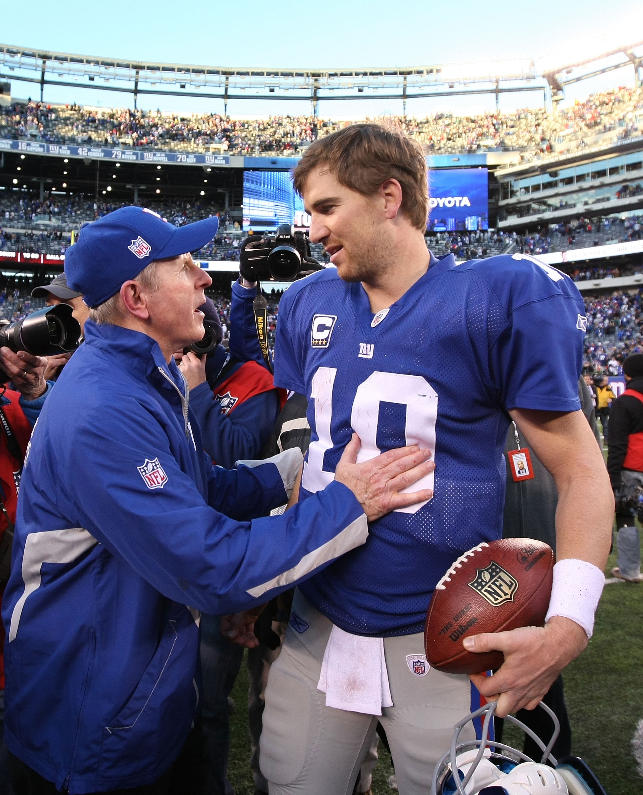 EAST RUTHERFORD, NJ - NOVEMBER 28:  Eli Manning #10 of the New York Giants is met by Giants Head Coach Tom Coughlin after their 24-20 win against the Jacksonville Jaguars on November 28, 2010 at The New Meadowlands Stadium in East Rutherford, New Jersey.
